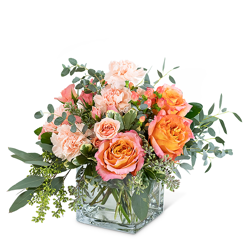 Living Coral - Looking for the perfect birthday or romantic gift? Make someone's day with the creatively designed Living Coral arrangement. Its highlighted flowers include Free Spirit Roses, peach carnation, hypericum berries, peach spray roses, and different varieties of eucalyptus. 