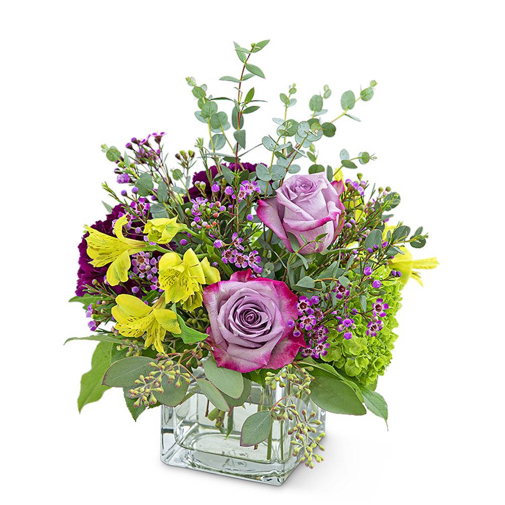 Sugar &amp; Plum - Are you wanting to send a sweet sentiment or gift? Our Sugar and Plum design features long-lasting Alstroemeria, purple carnations and roses, hydrangea, premium foliage, and wax flower accents. Sugar and Plum is a lovely way to send your love and appreciation! It will be the perfect complement to a home or office and will look stunning on a side table or desk.