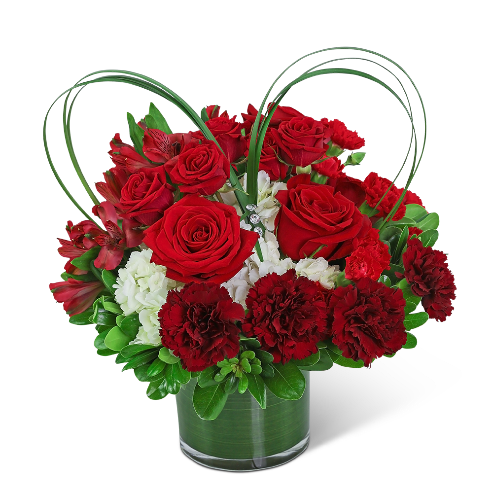 Red roses and carnations in a glass vase with heart-shaped loops