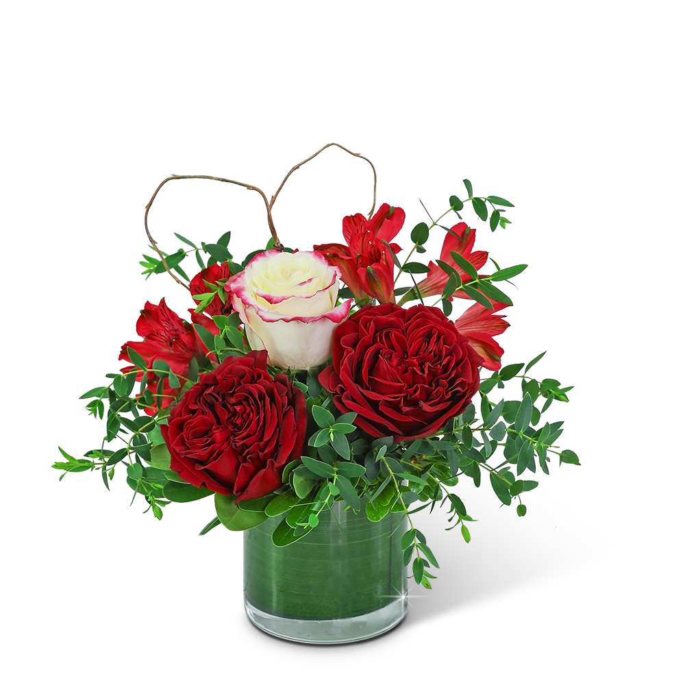 Red Romance - This gorgeous design is hand-arranged by our professional floral designers and delivered in a lovely leaf-lined vase. The rich, romantic colors of Red Romance are sure to melt the heart of your loved one. Beautiful ruffly roses, alstroemeria, and premium foliage are artfully arranged with a natural heart accent nestled in. Flower delivery has never been easier or more appreciated. Whether you are looking for a birthday, anniversary, or valentines day gift, we have flowers that are sure to fit the occasion!