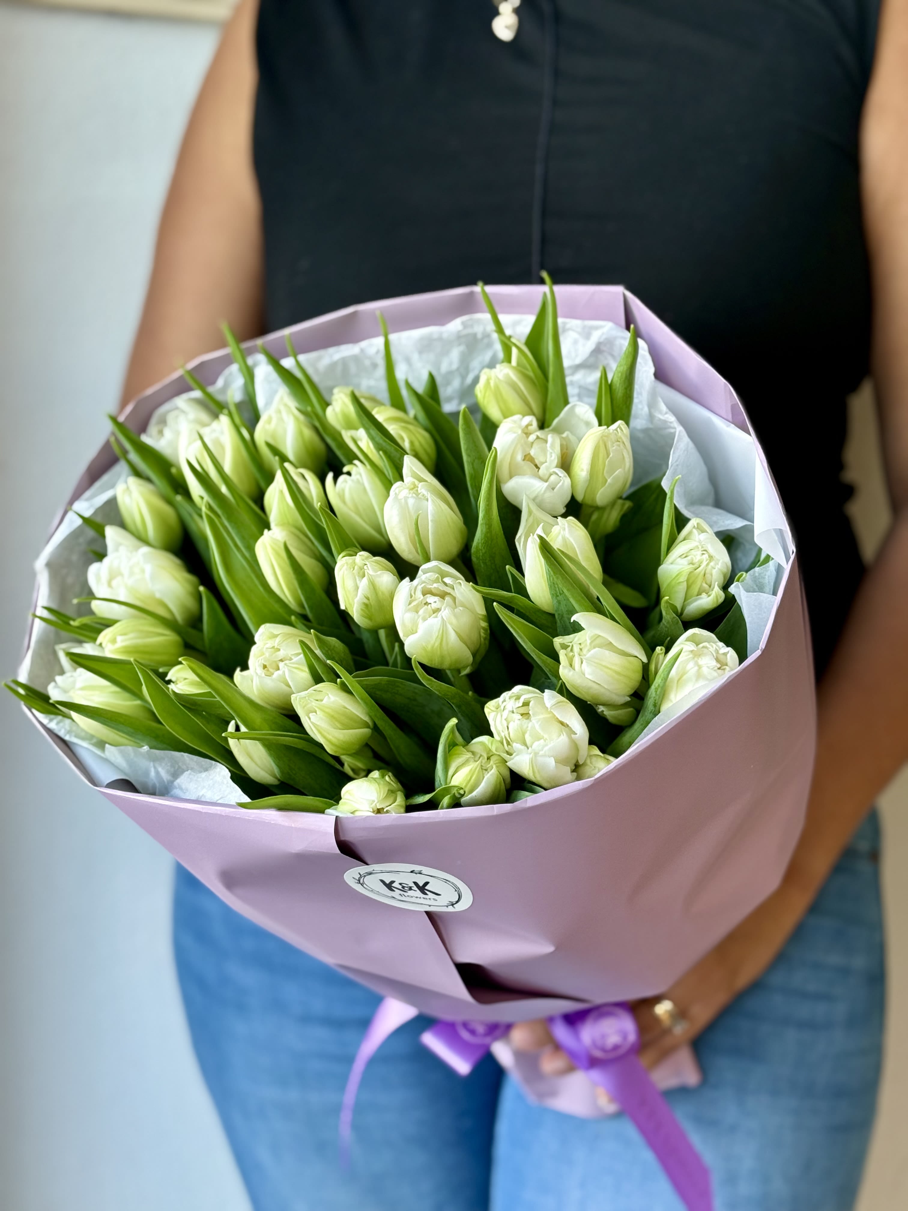 "White Elegance" Tulips bouquet - Sophisticated mono bouquets. TULIPS! The most popular spring flower. Colorful and long-lasting. The bouquet comes with mixed-color tulips and Solidago as a complementary flower. All bouquets come without a vase. You can choose a vase in the add-on section.  Standard- 30 stems Deluxe- 45 stems  Note: Flower food, transportation bag, and flower care instructions are included