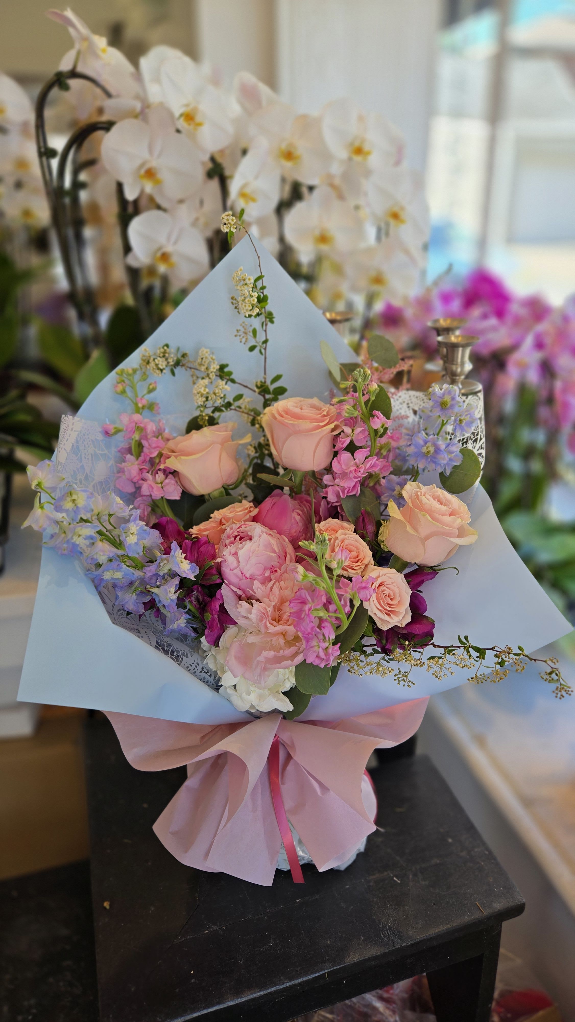 Hand-Tied Bouquet - DESIGNER'S CHOICE - *** Store Pickup ONLY *** -> If you want it to be delivered, please call at 201-592-9797 or 201-944-9797 This is a presentable bouquet wrapped in a very nice wrapping.  Please note that this is a DESIGNER'S CHOICE, so each bouquet has it's own character. Various flowers with many choices!  