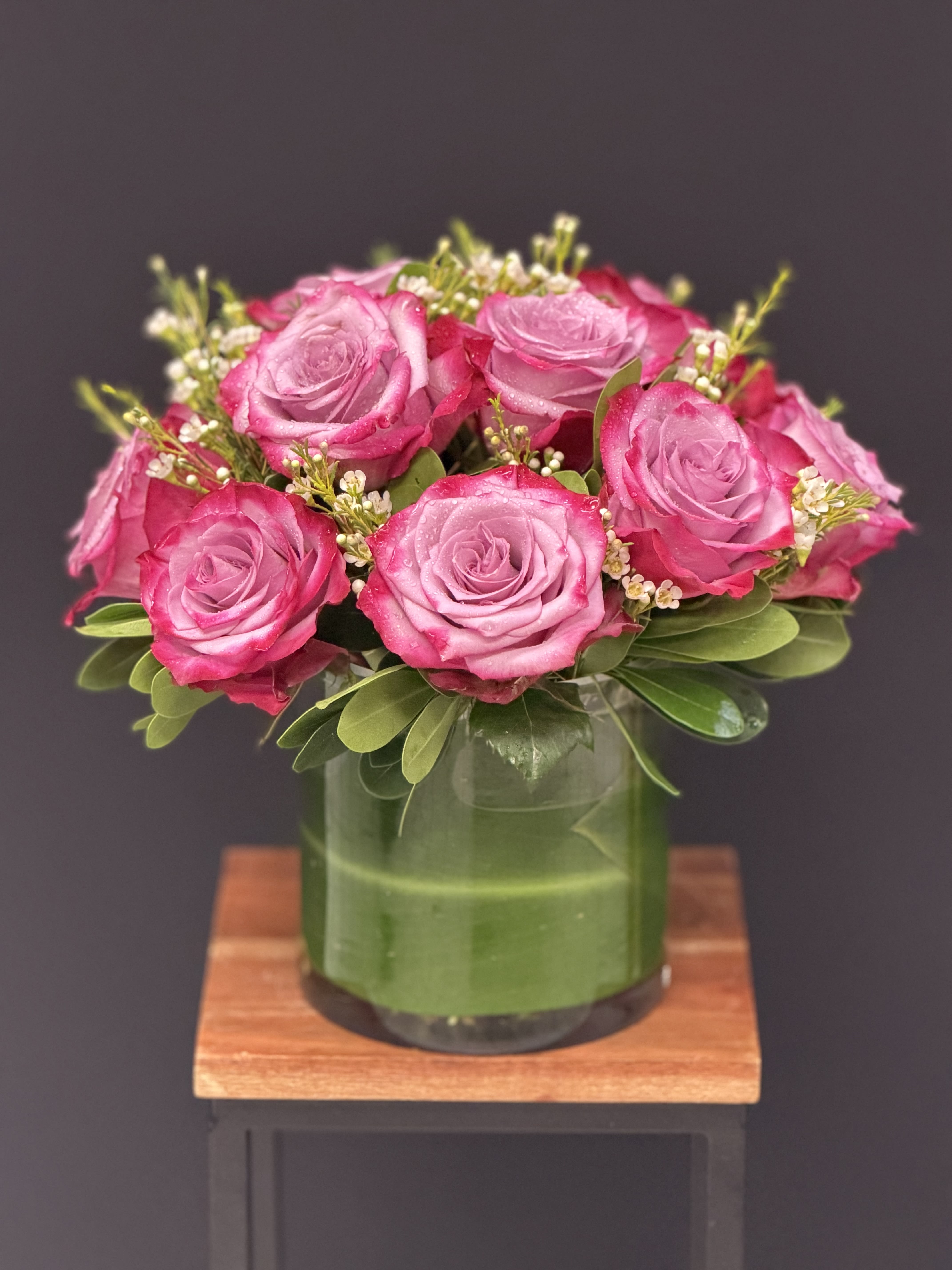 Enchanted Love by Eva's Garden - This beautiful lavender bouquet are guaranteed to brighten someone's day. Enchanted Love by Eva's Garden is perfect for someone's birthday or for anyone that needs cheering up.  Availble in other colors, Red, Yellow, Light Pink, Hot Pink   Arrangement Details:  Standard Dozen Lavender Roses, Deluxe 18 Roses, Premium 24 Roses
