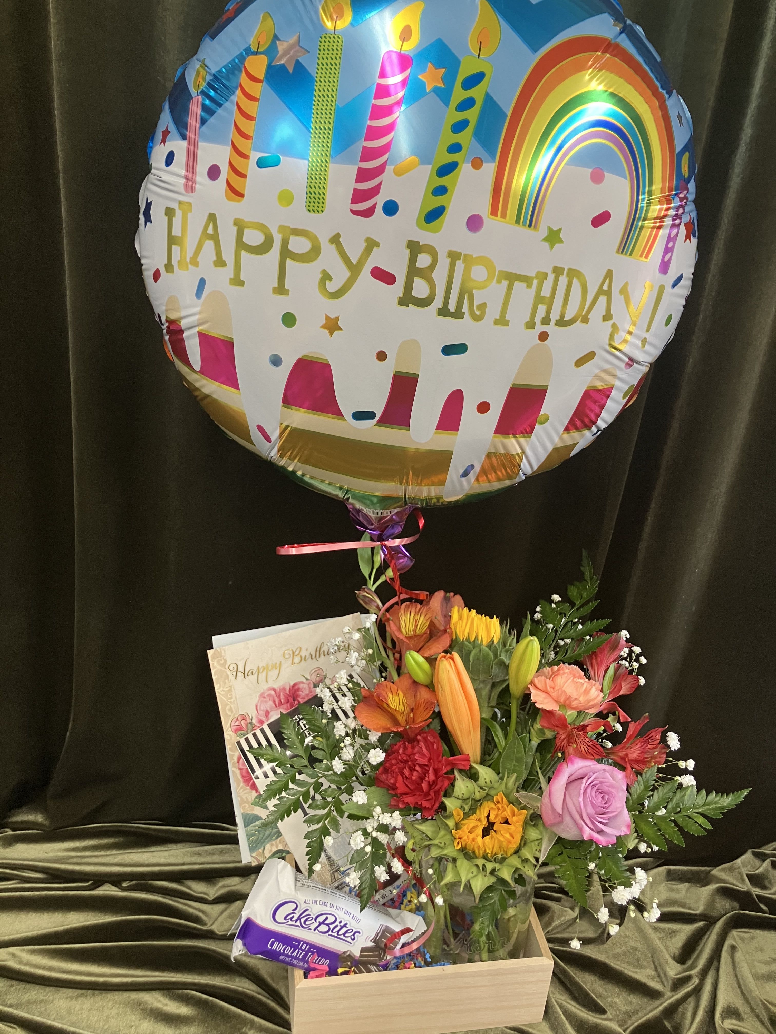 Birthday Party in a Box - Specifically designed for a mini birthday party, sweet treats, flowers and a happy birthday mylar balloon in a box! Items included in the box are a cakeBites, chocolates, a full size birthday card and a colorful fresh flower arrangement in a mason jar and mylar balloon. Send a special birthday gift to let them know you are celebrating with them in spirit!