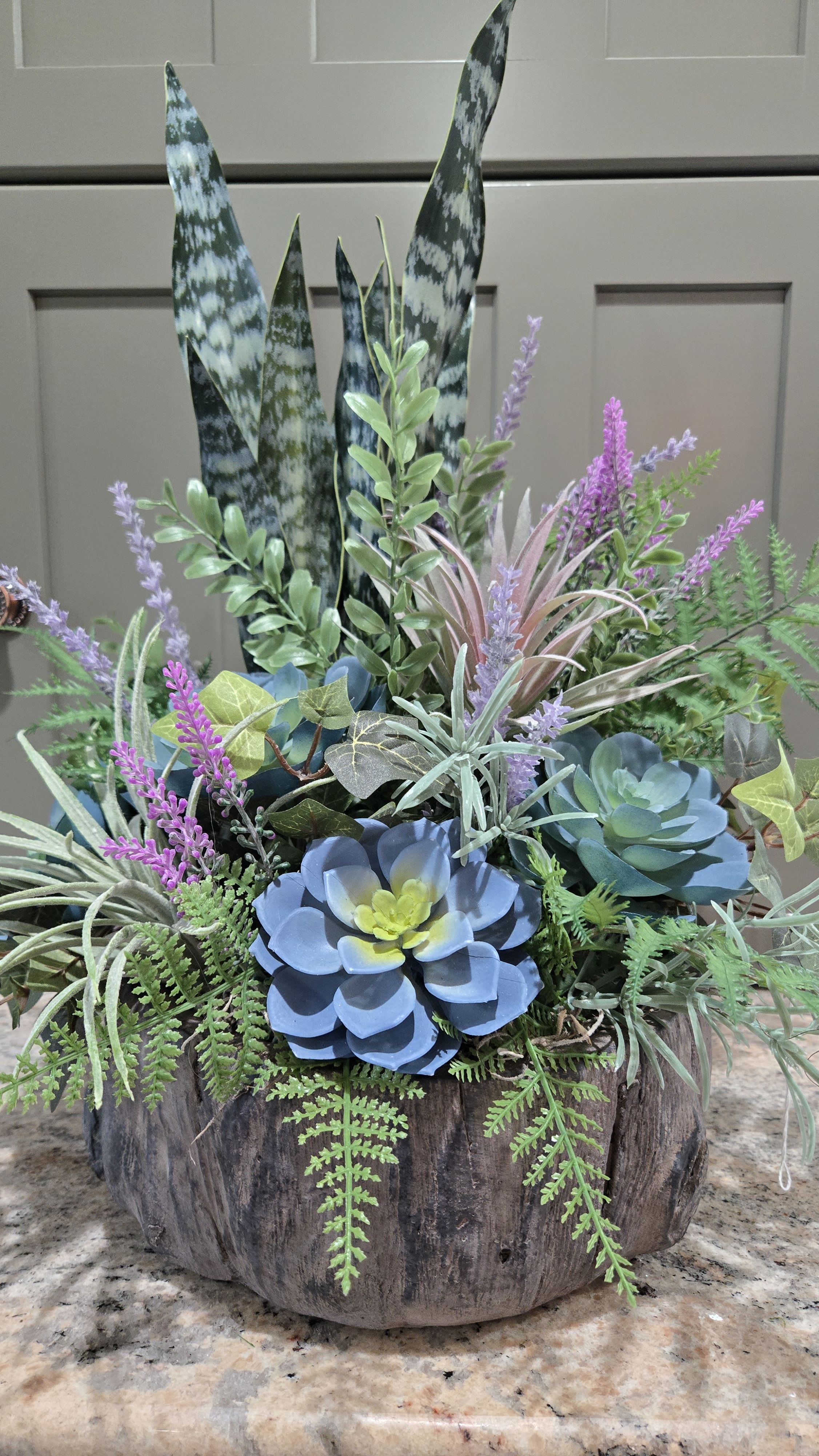 Faux Botanical Garden Planter  - Faux Botanical planter. Stunningly designed with quality, life-like ferns, snake &amp; air plants, succulent plants in a Stunningly bark-like base container.