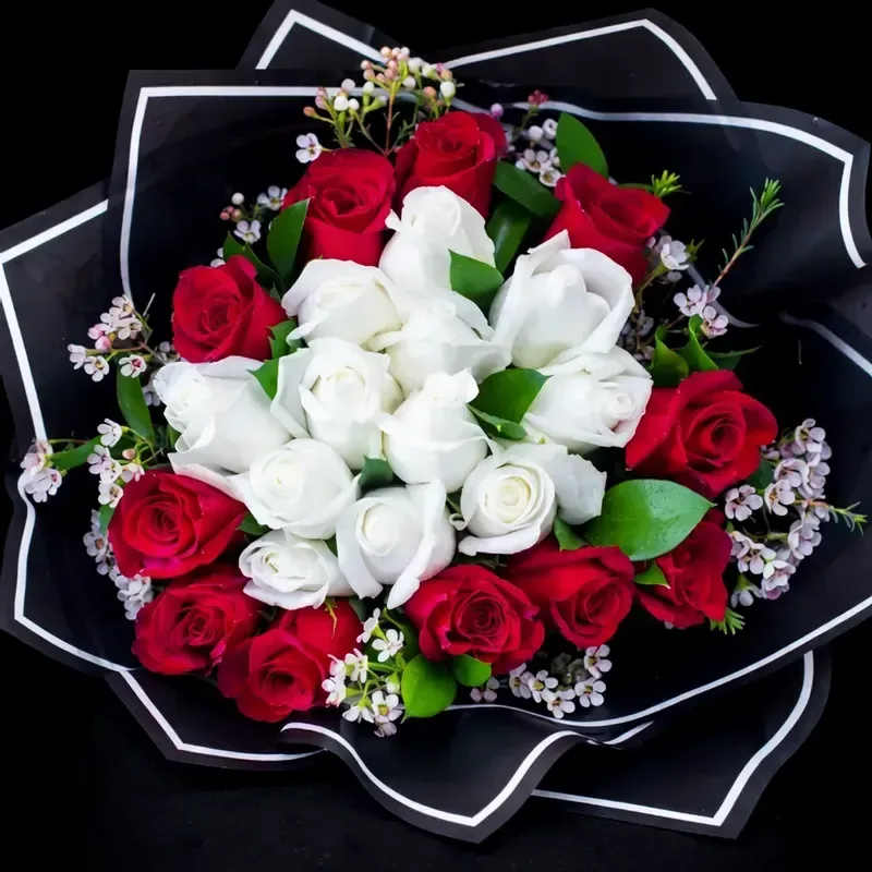 Adore you! - 2 dozen roses in red and white wrapped in a european style.  A center of white roses encased in a circle of red roses! With greens and wax flower. A beautiful bouquet to present to that special someone!  *No vase included. *