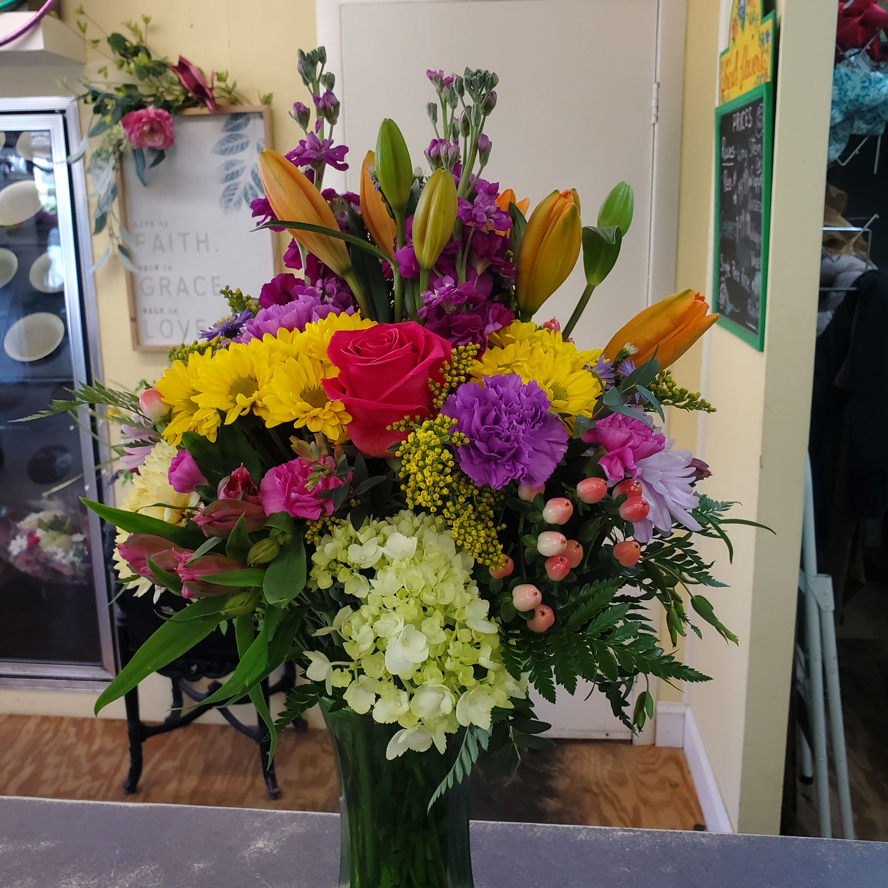 Spring Days  - A glass vase filled with assorted spring flowers.  A colorful combination. Sure to make someone smile!