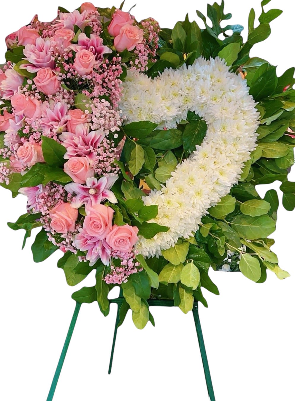 Pink and white floral standing wreath on a green easel