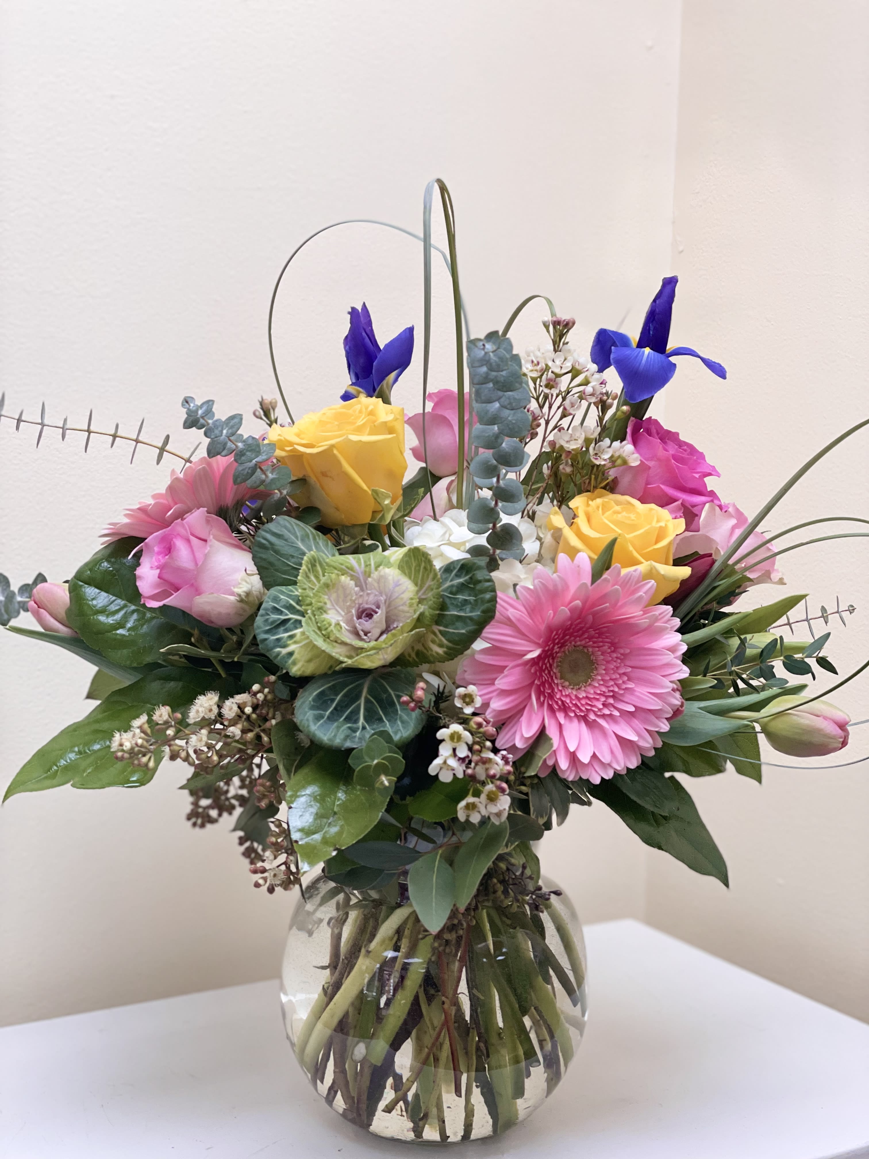 Spring Blossom  - Blossom-filled spring custom arrangement, cheery but elegant, surrounded by a assortment of mixed greens.