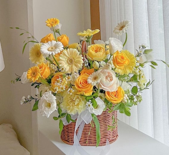Designer's Choice Summer Basket   - Our designer will create a gorgeous summery mix of beautiful, bright summer flowers offering an uplifting expression of your love. This basket is a designer's choice of fresh blooms what with have an organic style as if they were just cut from the garden.  Please note that every design will be different and the color scheme may vary.  The pictures provide an example of the style and feel of the basket.
