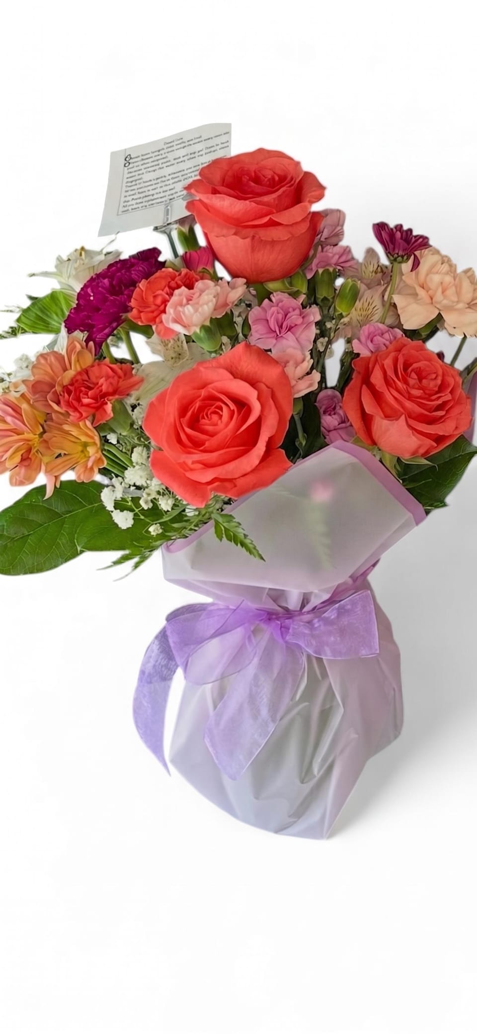 Mom´s hug - Fresh flowers mix in a vase with lavender wrapping paper. Color and flower substitution might apply