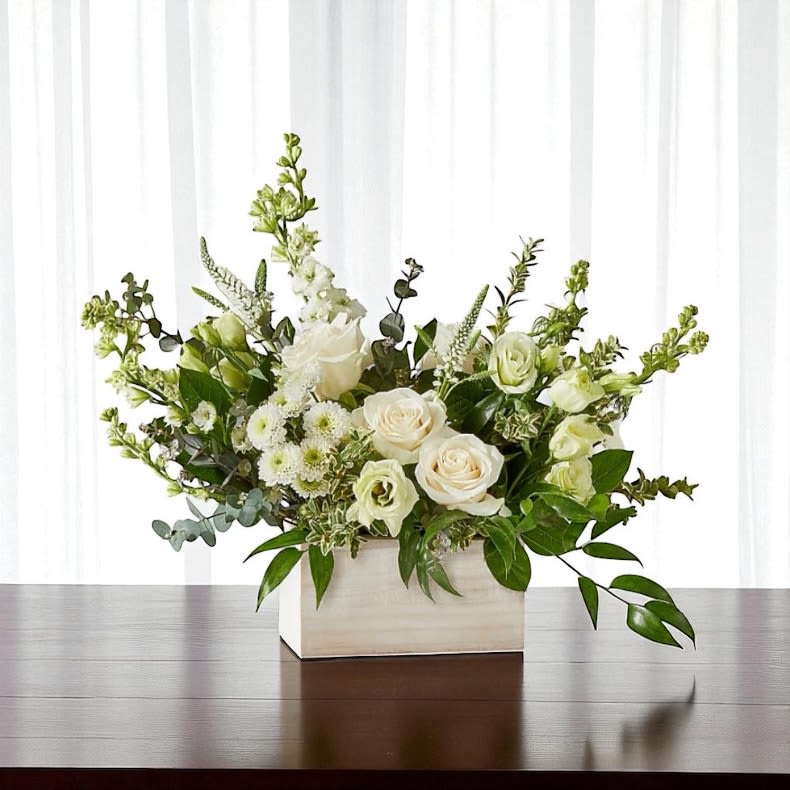 White floral arrangement in a rectangular white box