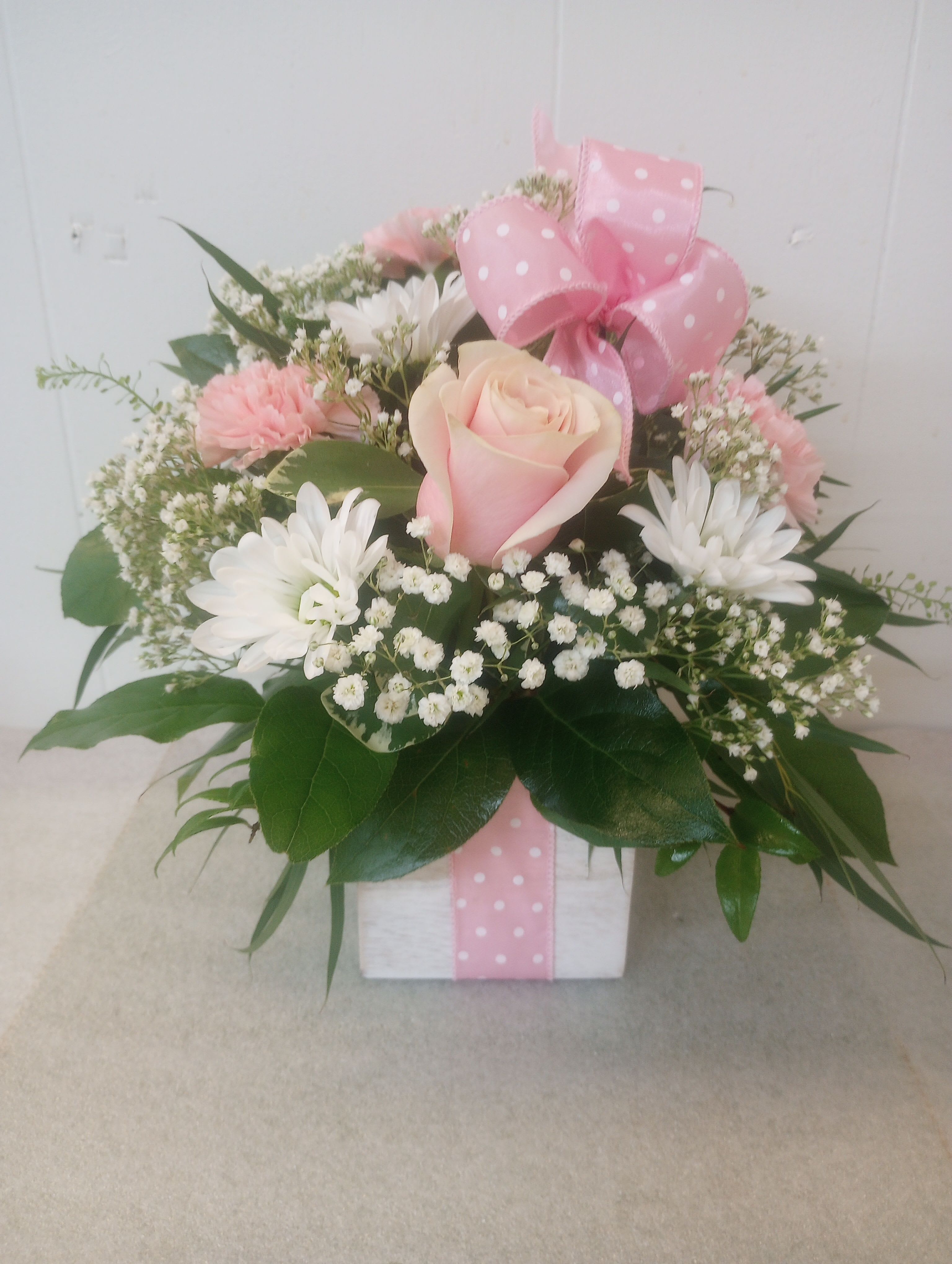 Gift in a box  - A single soft pink rose anchored at the center gives this flower arrangement its tender, heartfelt impression