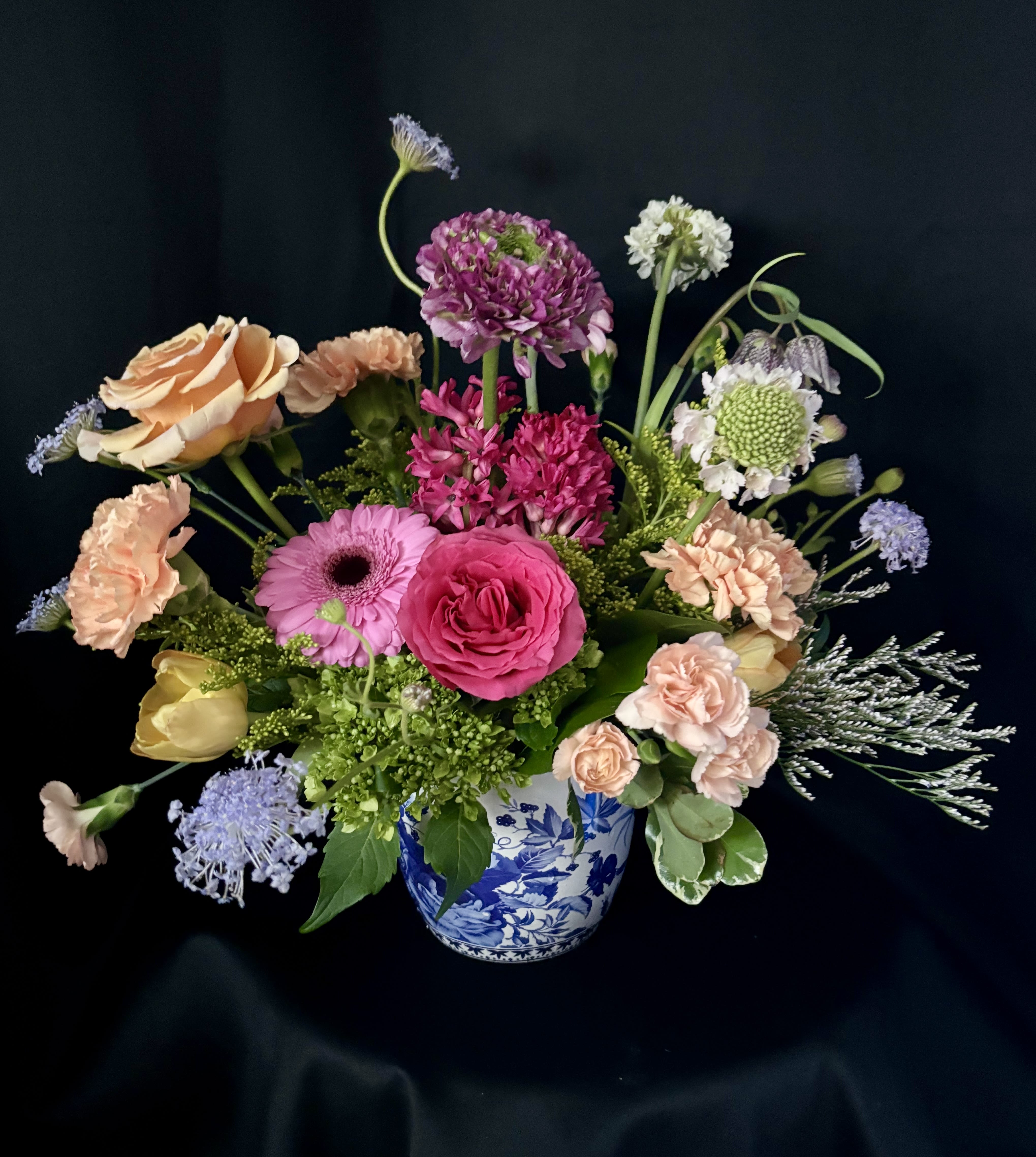 Designer's Choice Novelty Vased Arrangment - Back by popular demand, our blue and white novelty vase for Mother's Day! This is a "designer's choice" vased arrangement, but feel free to share Mom's favorite colors and flowers and we will do our best to accommodate! **WHILE SUPPLIES LAST