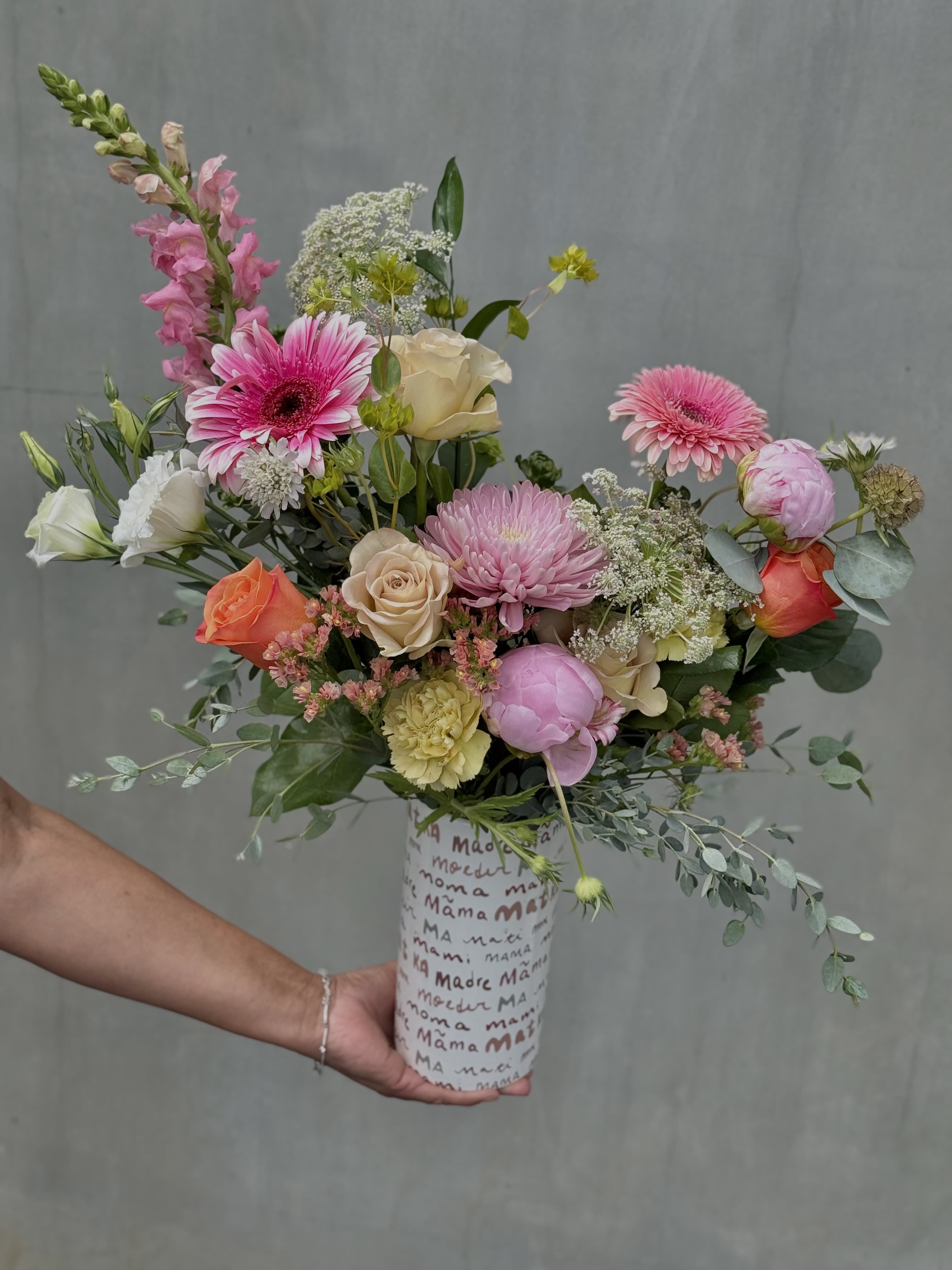 Letters to Mama  - Pink, peach and white garden-style blooms (gerbera, roses, carnations, lisianthus, snapdragons) arranged in a unique vase perfect for the Moms