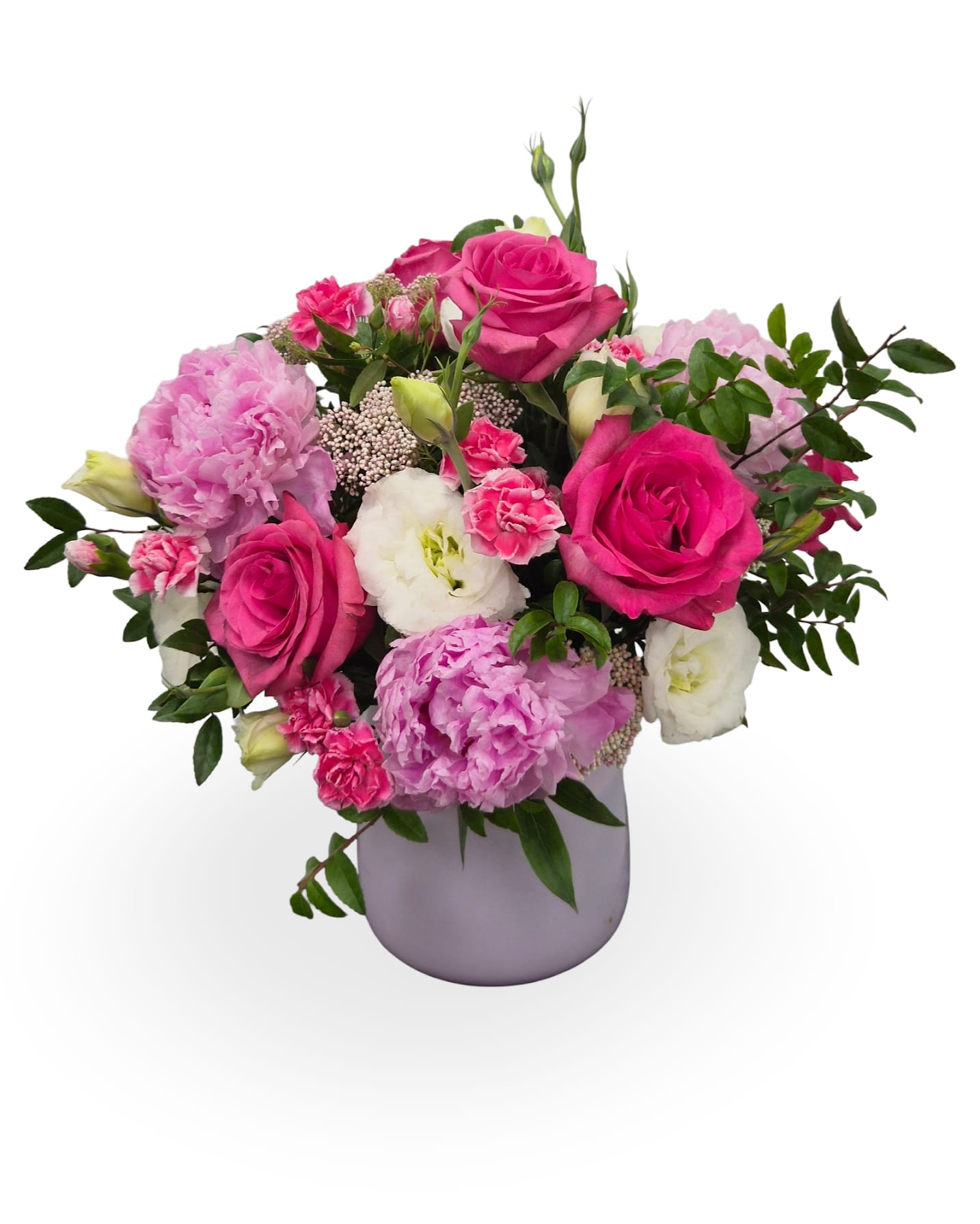 Hot Mama - Bright, hot pink roses and lush pink peonies take center stage in this Mother's Day flower arrangement, paired with pink mini carnations, delicate lisianthus-style white guaranteed blooms, and wisps of rice flower for a soft, textured contrast. Designed as a garden-style, rounded bouquet, the vivid magenta and pale blush palette reads romantic and cheerful-the kind of gift that makes the person you're thinking of feel celebrated and adored.  Arranged densely with airy greenery in a pink glass vase, the composition has a full, layered look that blends roses, carnations, and lisianthus blooms for both substance and movement. Dimensions: approximately 18 x 14 inches.