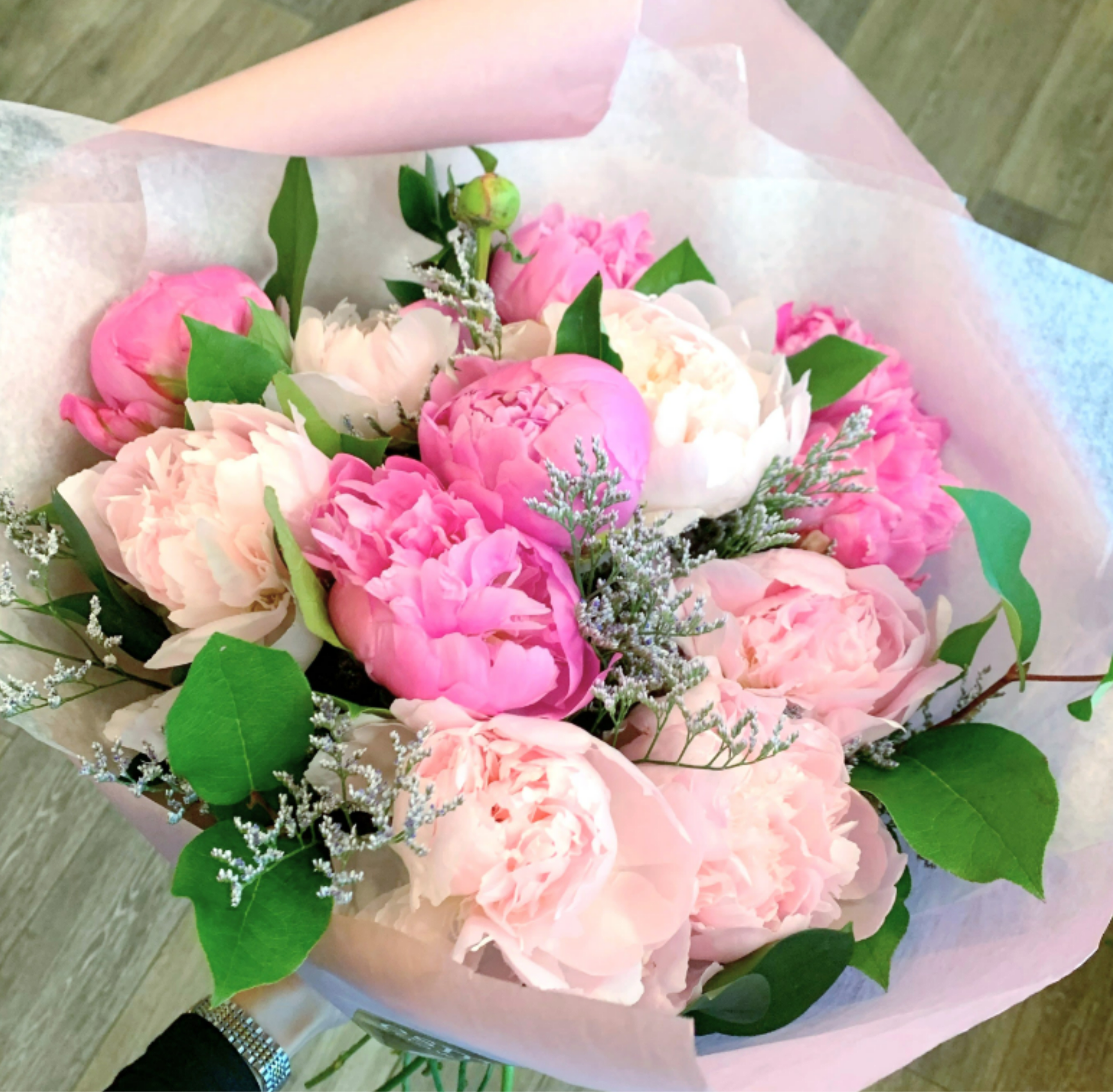 Peony Bouquet - Hand Wrapped - Gorgeous Dutch Peonies come together in this hand-wrapped bouquet for the peony lover! Each fluffy bloom is thoughtfully arranged to highlight its natural beauty, beautiful wrapped in our signature premium paper packaging. THE BOUQUET DOES NOT COME IN A VASE. 