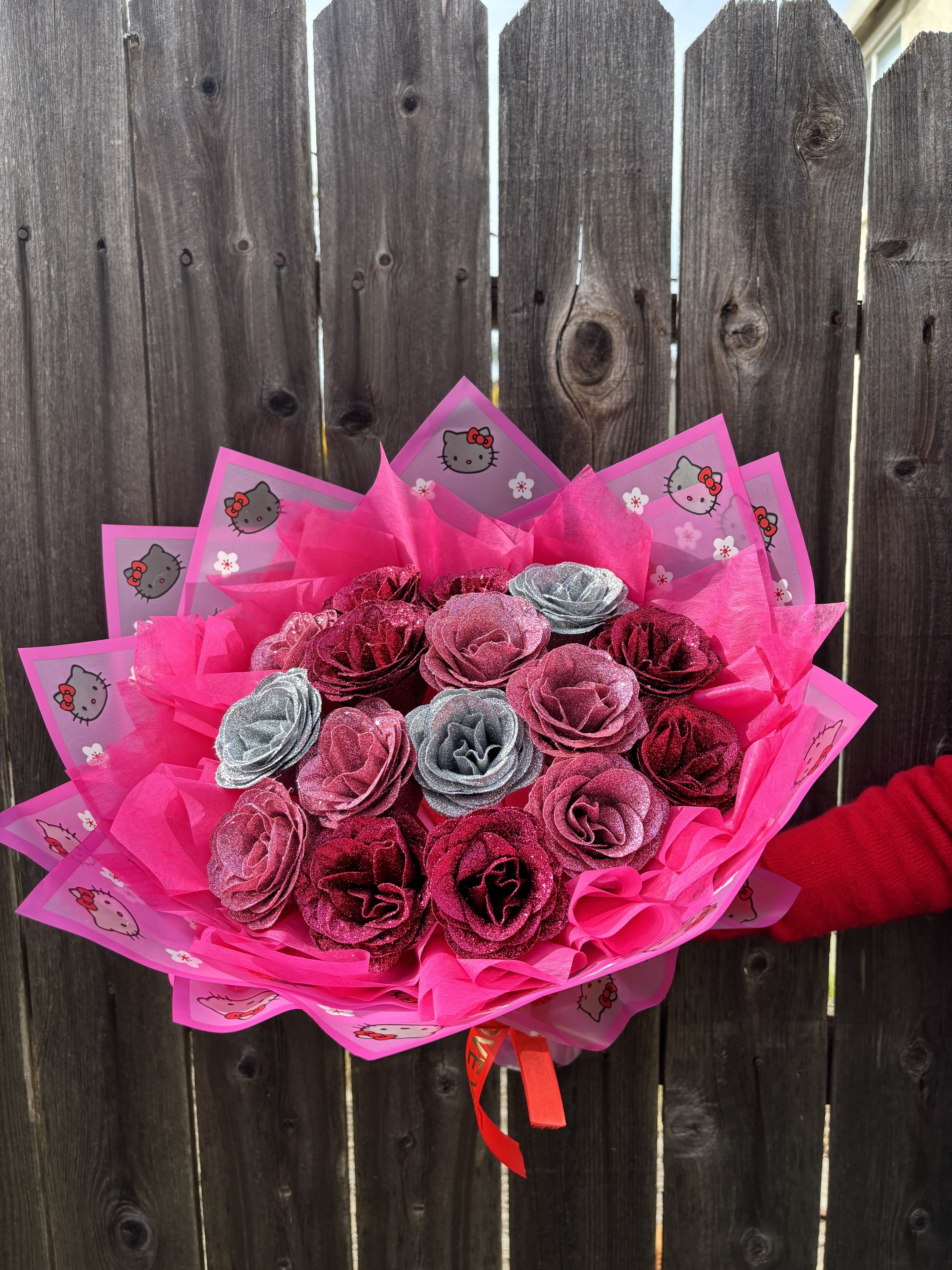 Pink glitter rose bouquet wrapped in Hello Kitty paper