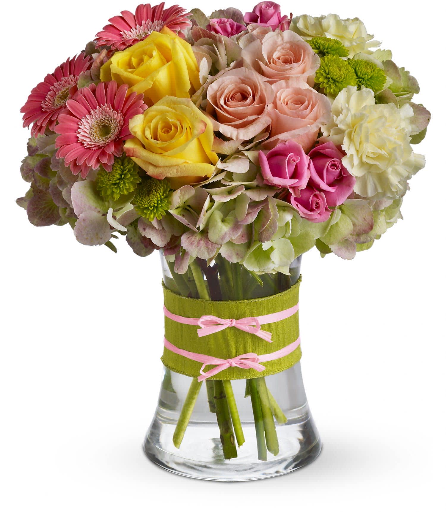 Mixed bouquet of pink gerberas, roses, hydrangeas and yellow roses in a clear vase with green ribbon