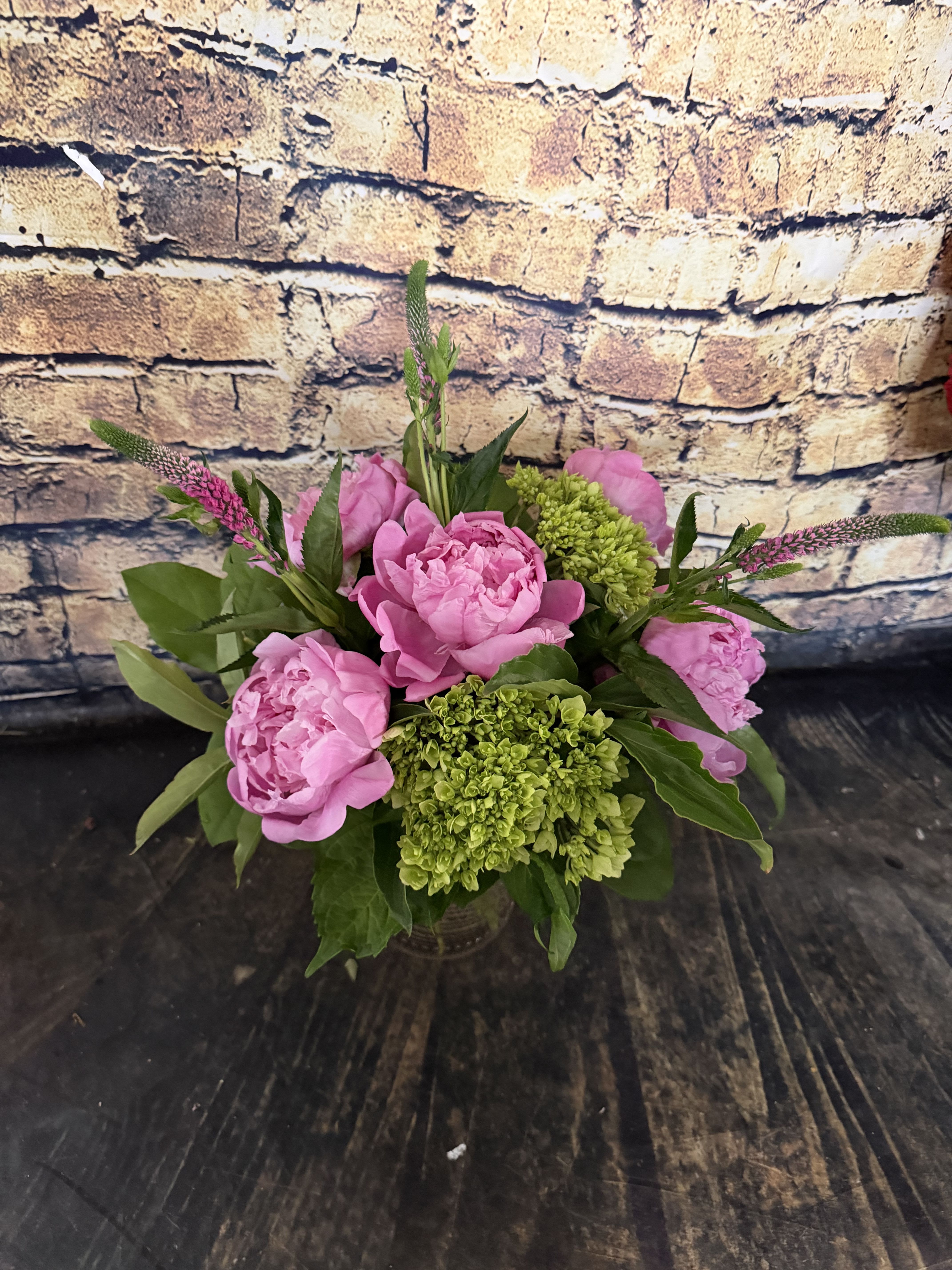 Peony Carafe  - Stunning peonies mixed with mini green hydrangeas and adorned by Veronica in a food safe Carafe!  A wonderful gift With a fun keepsake vase for later!