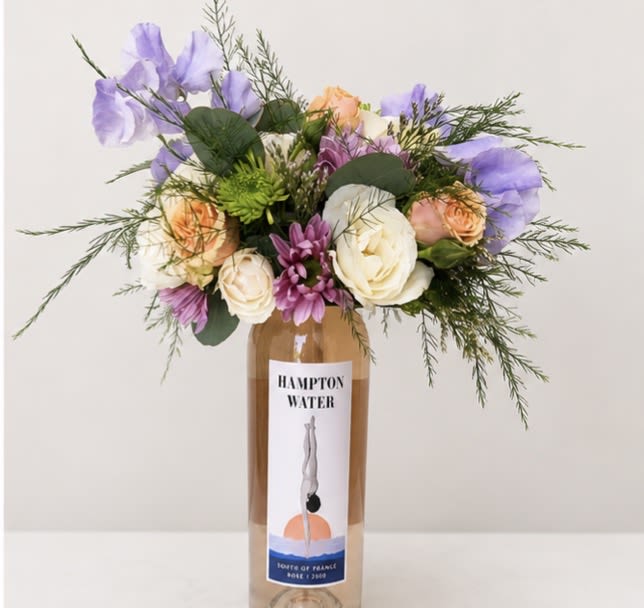 Booze-quet - Rosé (750ml) - New at The Virginia Florist! A beautiful, seasonal arrangement on top of a high quality bottle of wine! What more can you ask for? When you're ready to enjoy the wine, easily lift off the arrangement and set in a shallow dish with water to continue it's beauty.