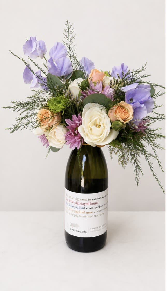Booze-quet - Sauvignon Blanc (750ml) - New at The Virginia Florist! A beautiful, seasonal arrangement on top of a high quality bottle of wine! What more can you ask for? When you're ready to enjoy the wine, easily lift off the arrangement and set in a shallow dish with water.