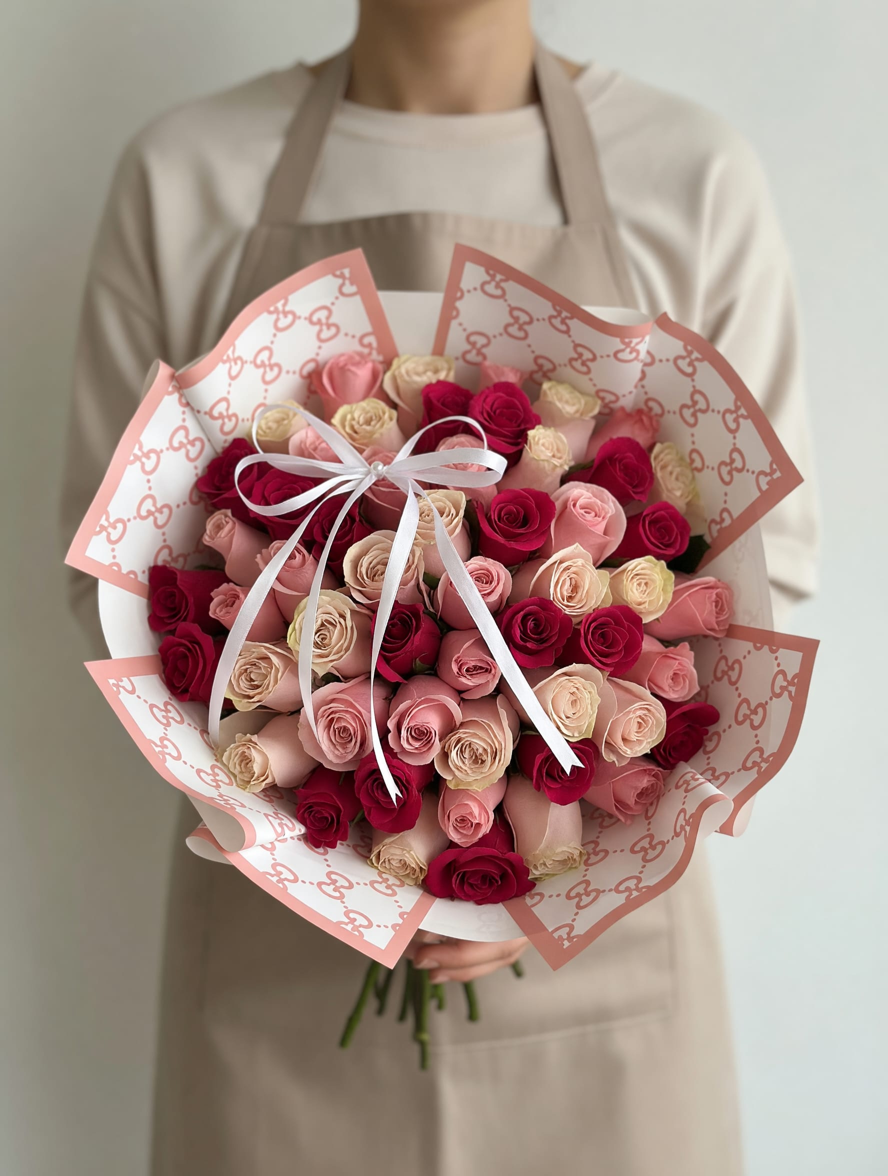 Blush, Ivory &amp; Red Rose Bouquet - A stunning bouquet featuring a harmonious blend of blush pink, ivory, and rich red roses, carefully arranged in a full, rounded design and wrapped in elegant patterned paper with a refined ribbon finish. Blush, Ivory &amp; Red Rose Bouquet combines softness and passion, creating a sophisticated and eye-catching floral piece perfect for any special occasion.