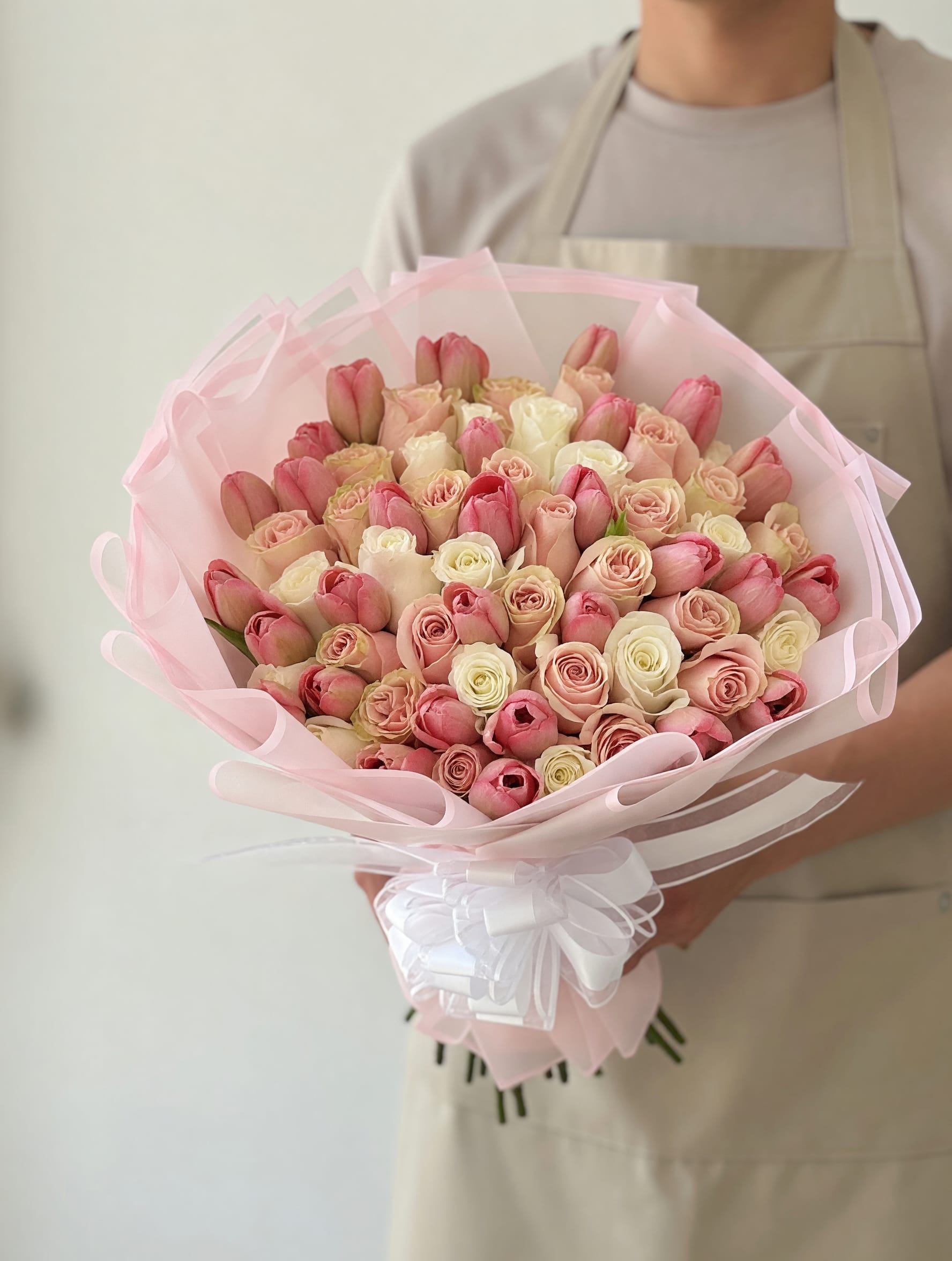 Blush Tulip &amp; Rose Luxury Bouquet - A refined and luxurious bouquet featuring a delicate blend of blush pink tulips, soft pink roses, and creamy ivory roses, beautifully arranged in a full, rounded design. Wrapped in elegant pastel layers with a sophisticated ribbon finish, Blush Tulip &amp; Rose Luxury Bouquet is designed to express grace, sweetness, and timeless elegance.