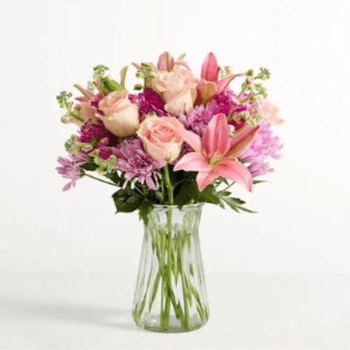 Made for Mom Flower -  Pet Friendly? No - This arrangement contains Lilies and Chrysanthemums, both of which are highly toxic to household pets.  Lilies are particularly dangerous for cats and can cause kidney failure even in small amounts.    Keep out of reach; avoid homes with curious cats or dogs.   Human Allergy Note : This bouquet contains pollen-heavy Lilies and Chrysanthemums which may trigger seasonal sensitivities. We recommend removing the orange anthers from the center of the lilies as they open to reduce pollen spread and prevent staining.   Care &amp; Longevity :  To keep your blooms fresh, trim the stems at a 45-degree angle and place them in a clean vase with fresh, lukewarm water. Change the water every two days, avoid placing the arrangement near direct sun, heat sources, or AC vents, and remove any fading blooms to prevent bacteria growth.   Best Occasions &amp; Situations :  - Milestone Birthday  - Mother’s Day  - Job Promotion  - Get Well Soon  - New Home Warming  - Just Because  - Teacher Appreciation   Why Customers Love It :  - Stunning color balance between soft pastels and bold magentas. - Impressive height and volume that makes it a true statement piece. - Gift-ready presentation in a high-quality glass vase. - Very versatile for both celebratory and “thinking of you” moments.