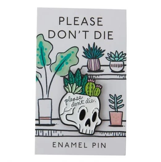 Enamel pin card with a skull planter and potted succulents