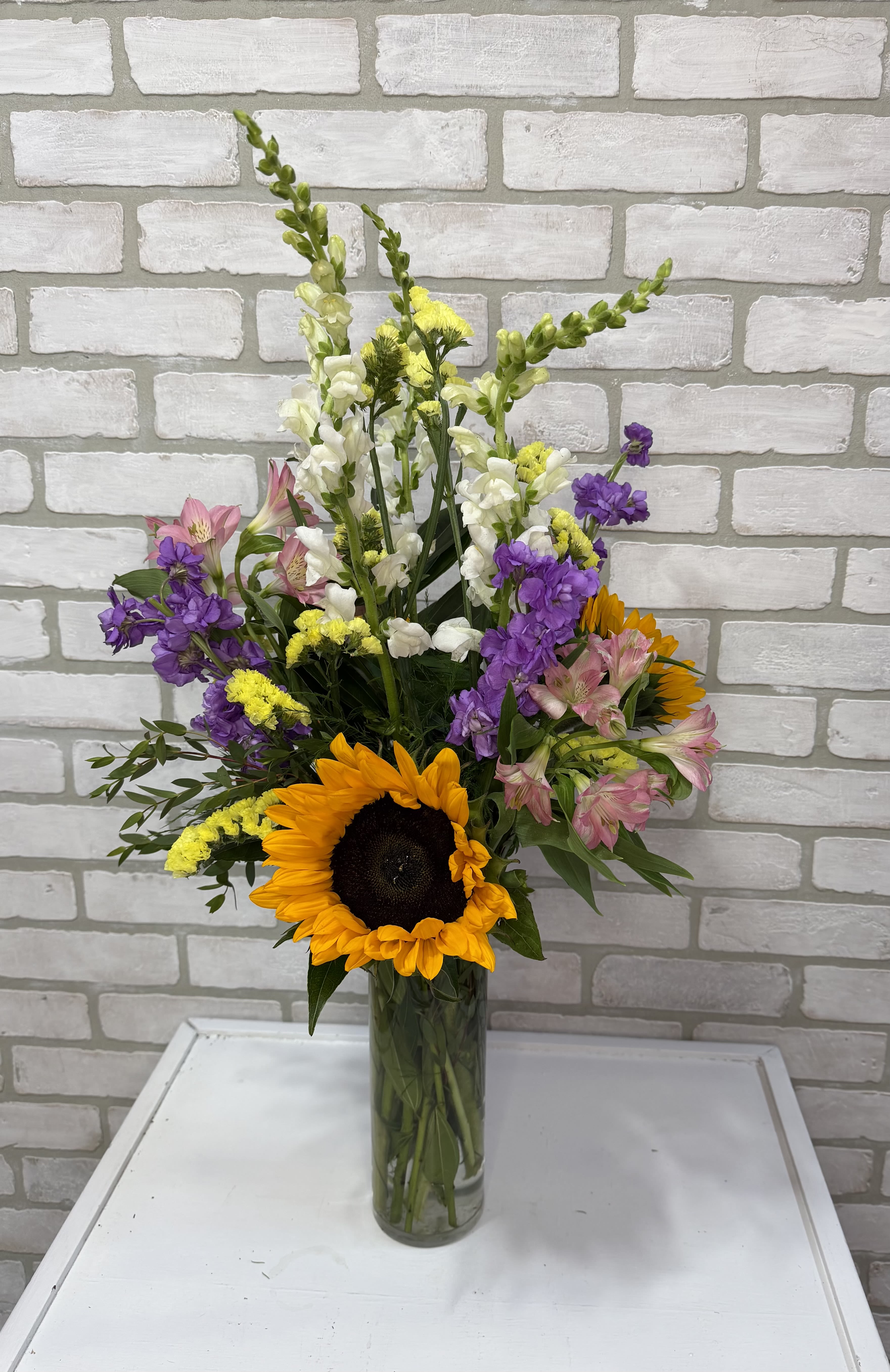 Sunshine of Your Love  - You can never go wrong with sunflowers and daisies. Always a delight! 