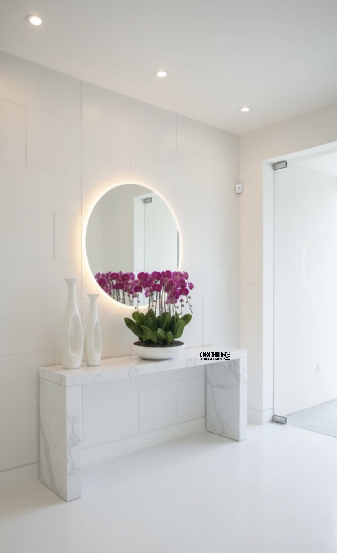 Purple orchids in a white bowl on a marble console table