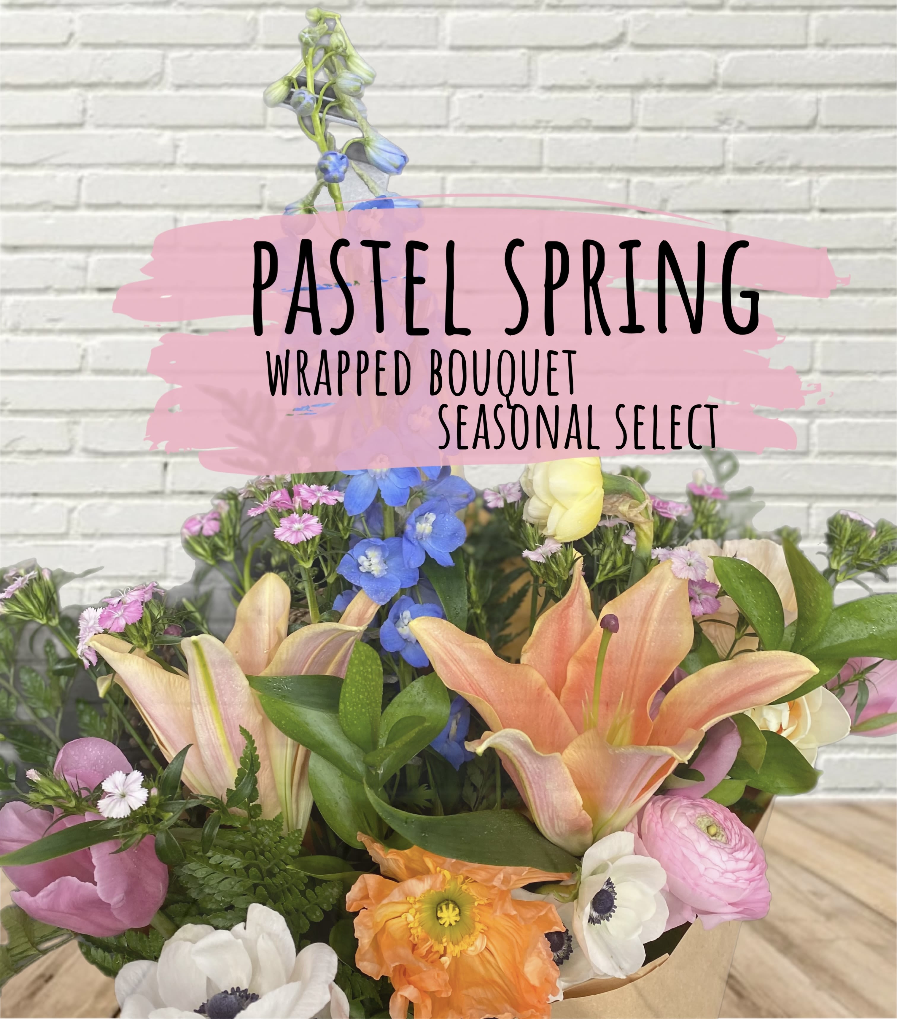 Wrapped bouquet with lilies, poppies, and mixed pastel flowers