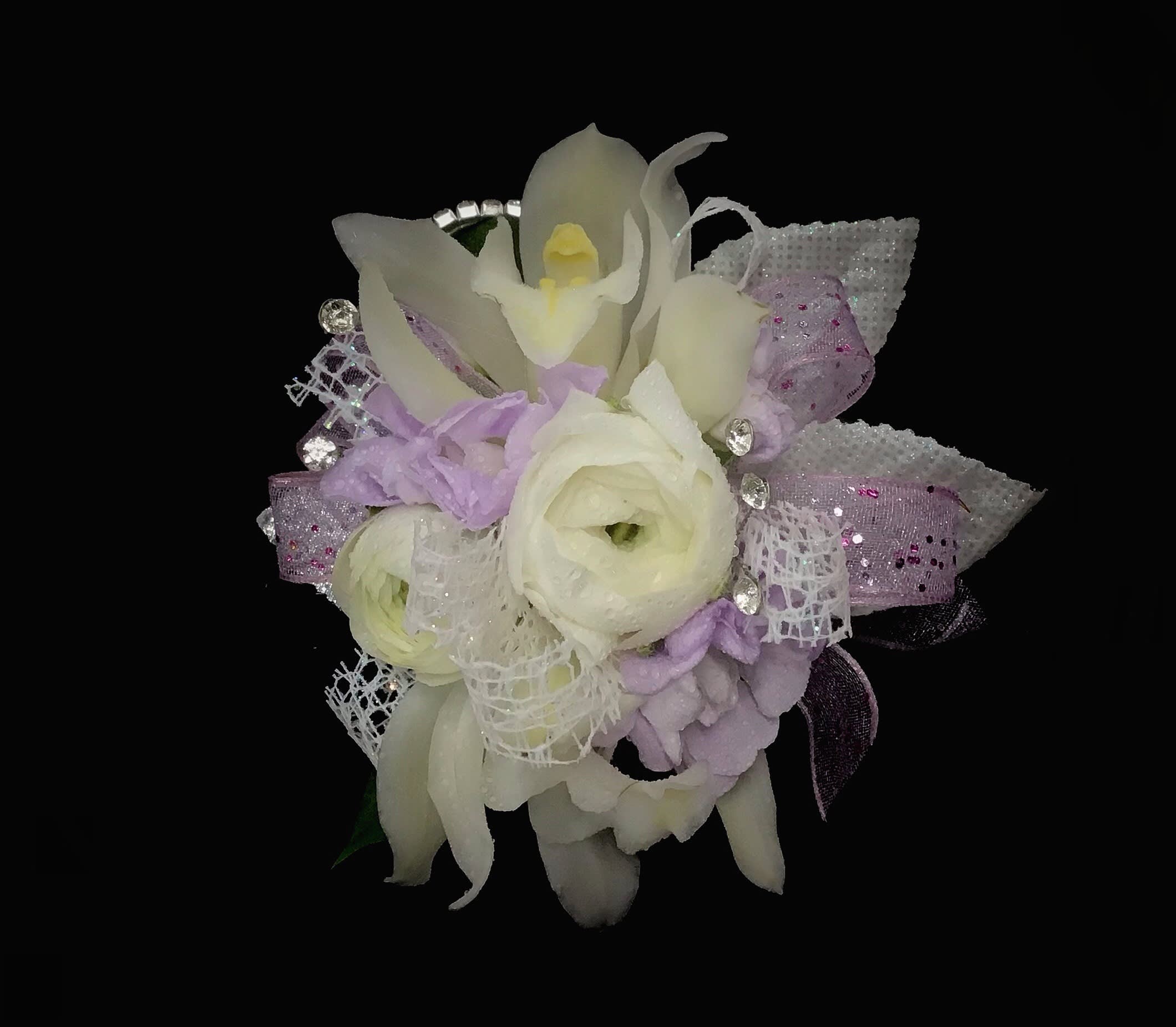 Shades of Purple, Lavender &amp; White Prom Corsage - A rhinestone elastic wrist band with lavender, purple and white flowers. Please list the dress color if you want us to be more specific. ***Pictures are for inspiration- the actual corsage may vary from samples shown