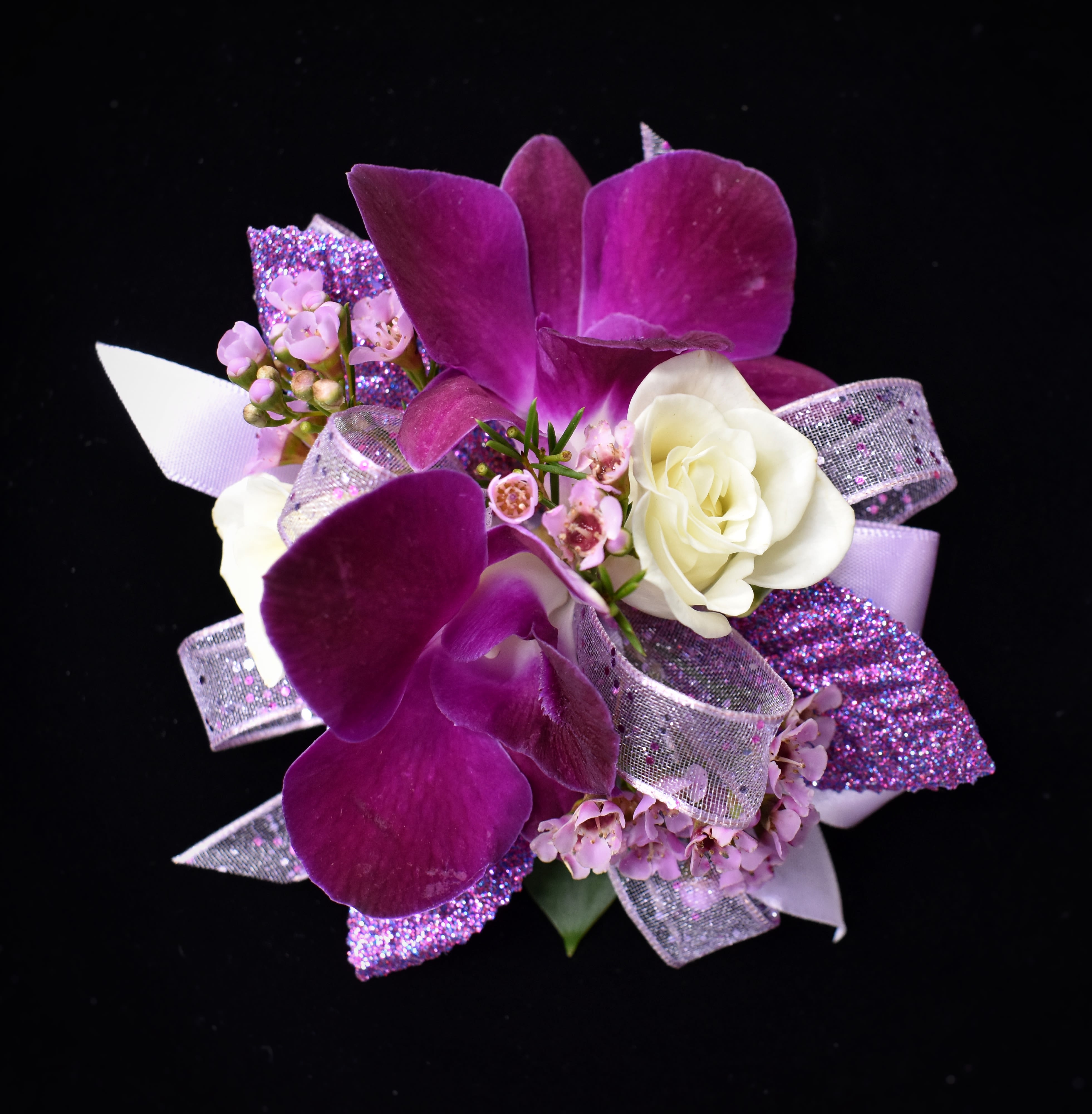 Purple orchid corsage with white rose and glitter ribbon