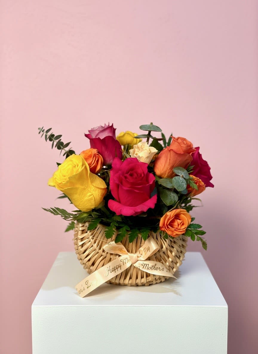 Little Joy - Roses in bright pink, red, yellow, orange and soft cream make this flower arrangement an instant mood-lifter - perfect as a Mother's Day arrangement or a cheerful birthday gift. Little Joy is designed to make the person you're celebrating feel seen: the saturated colors and romantic rose shapes read as both joyful and intimate, a warm way to say "thank you" or "I'm thinking of you."  Ideal for moms, grandmothers, or anyone who delights in bright, classic blooms, this piece arrives ready to display; no extra vase needed1