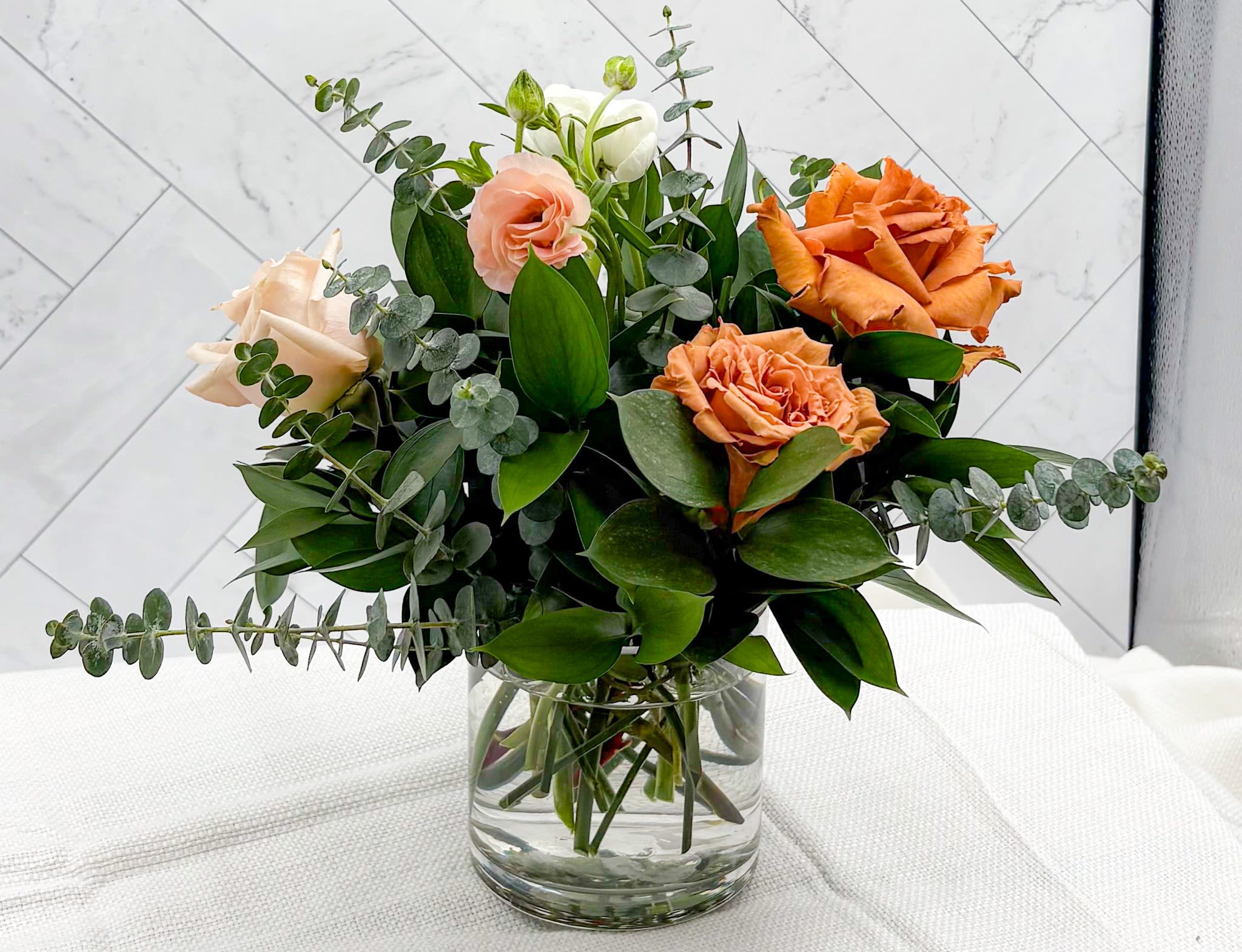 ESPRESSO MOM-TINI - Part of our Mother's Day "Mom-Tini Collection", the Espresso Mom-Tini is the perfect arrangement to gift the Espresso Martini lover in your life. This arrangement is full of Toffee &amp; Quicksand roses, Lisianthus, Ranunculus, Berries, Eucalyptus &amp; upscale greenery. Add a little something extra, gourmet chocolates, hand poured candles. See all our gift selections under the thoughtful gifts tab. Or call the shop and let us know what you are looking for and we will do the shopping for you.