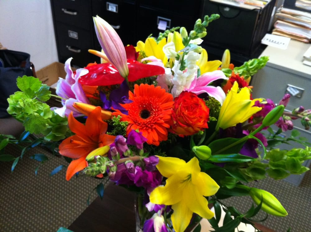 Brighten Mom's Day  - Perfect for the office superstar! A nice mix of gright and cheerful flowers. This gift goes a long way!