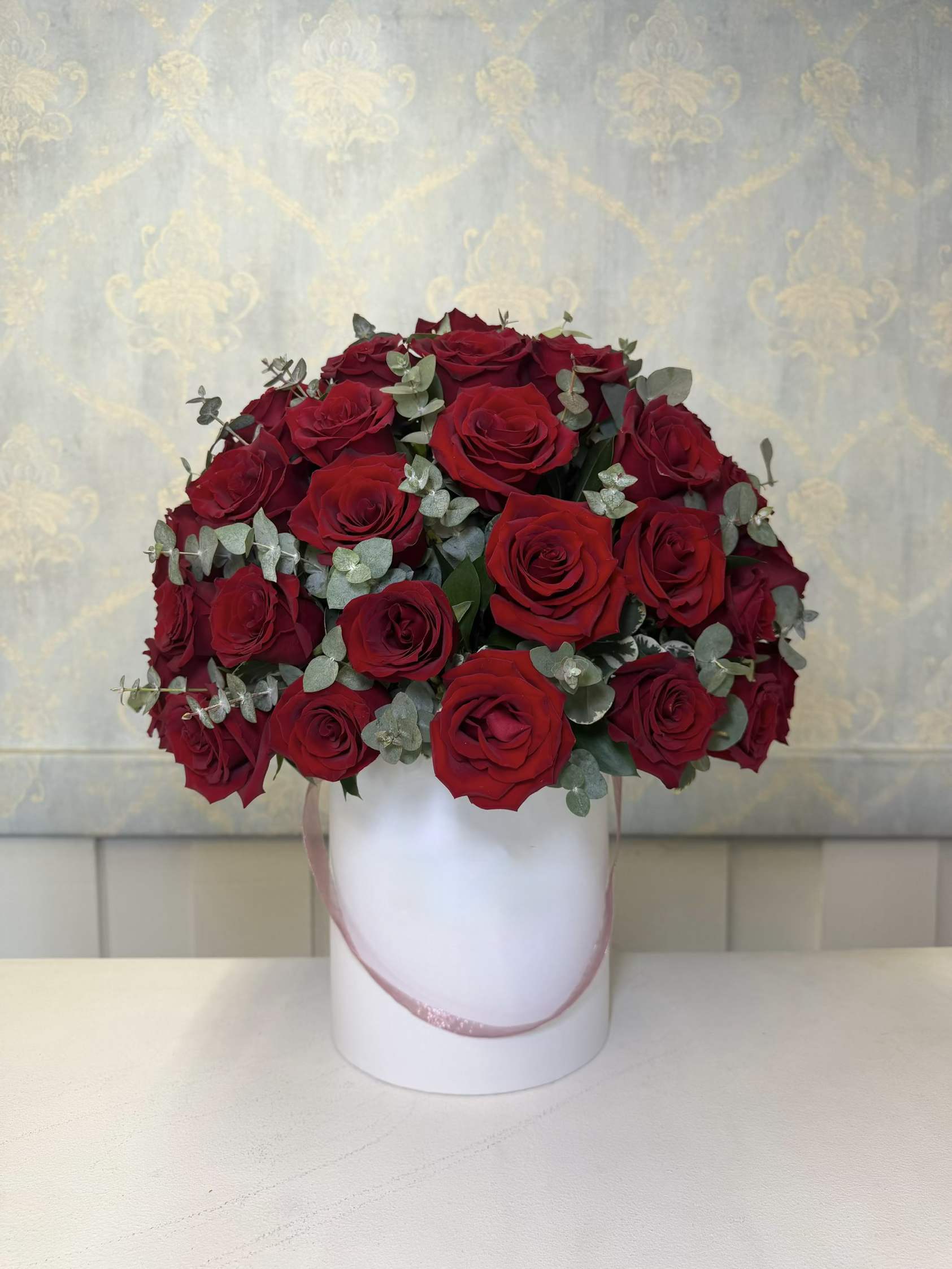Luxury Red Velvet  - Make a lasting impression with our stunning Luxury Red Velvet arrangement  This luxurious floral design features 50 premium red roses beautifully arranged in an elegant modern base and accented with fresh greenery that enhances the beauty and richness of every rose.  A timeless arrangement that symbolizes love, passion, and elegance — perfect for anniversaries, romantic surprises, birthdays, or any special occasion where you want to truly impress.   A classic, luxurious, and unforgettable arrangement designed to steal hearts instantly.
