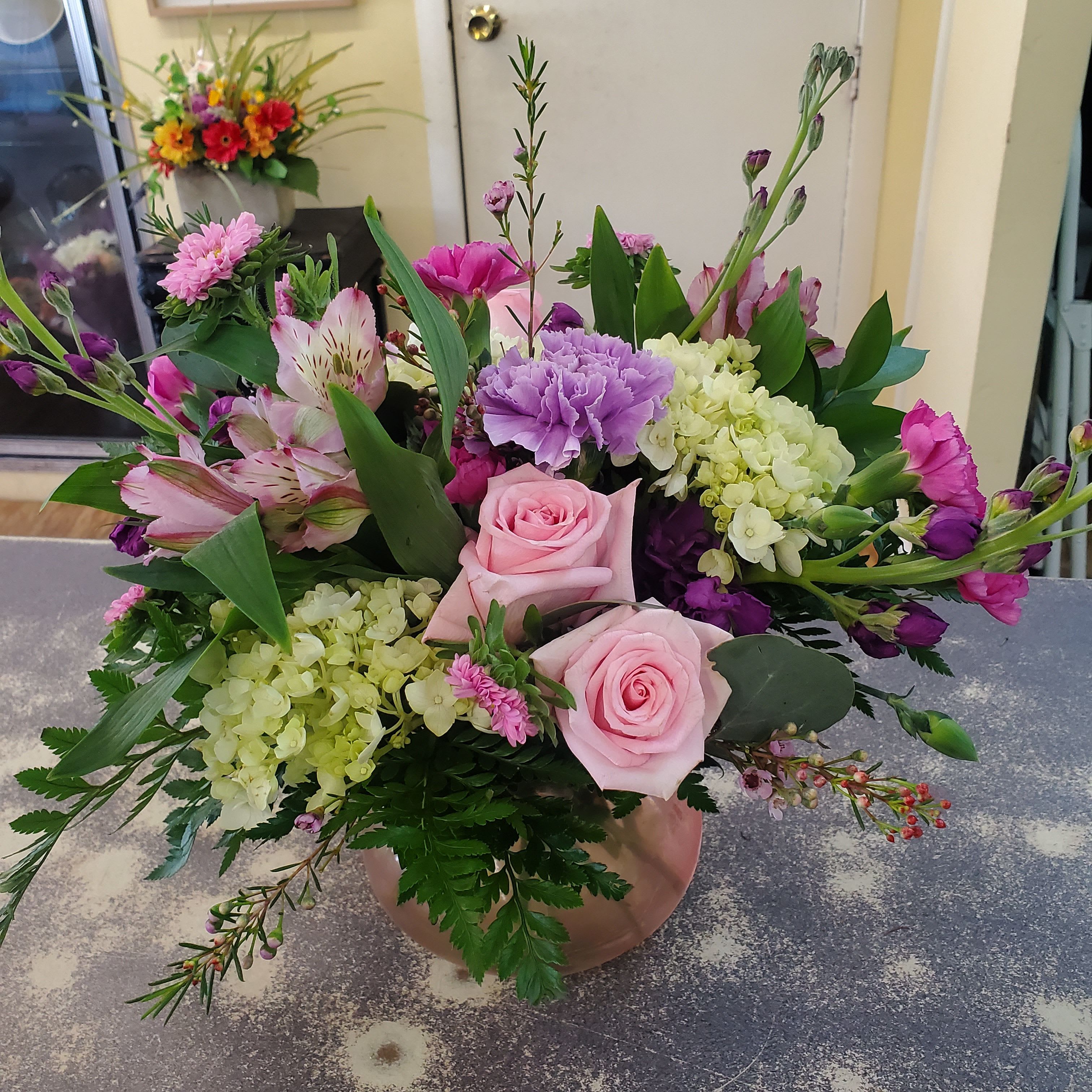 Pastel Perfection  - A vase arrangement filled with a assortment of pastel blooms. Suitable for all occasions. **Low compact design **