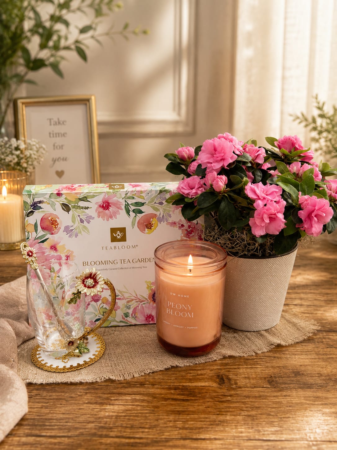 Tea garden  - A luxurious and relaxing gift set featuring a vibrant blooming azalea plant, elegant floral tea collection, decorative glass tea cup, and soft peony-scented candle. Designed to create a peaceful moment of comfort and beauty, this thoughtful gift is perfect for Mother’s Day, birthdays, thank you gifts, sympathy, or simply treating someone special.