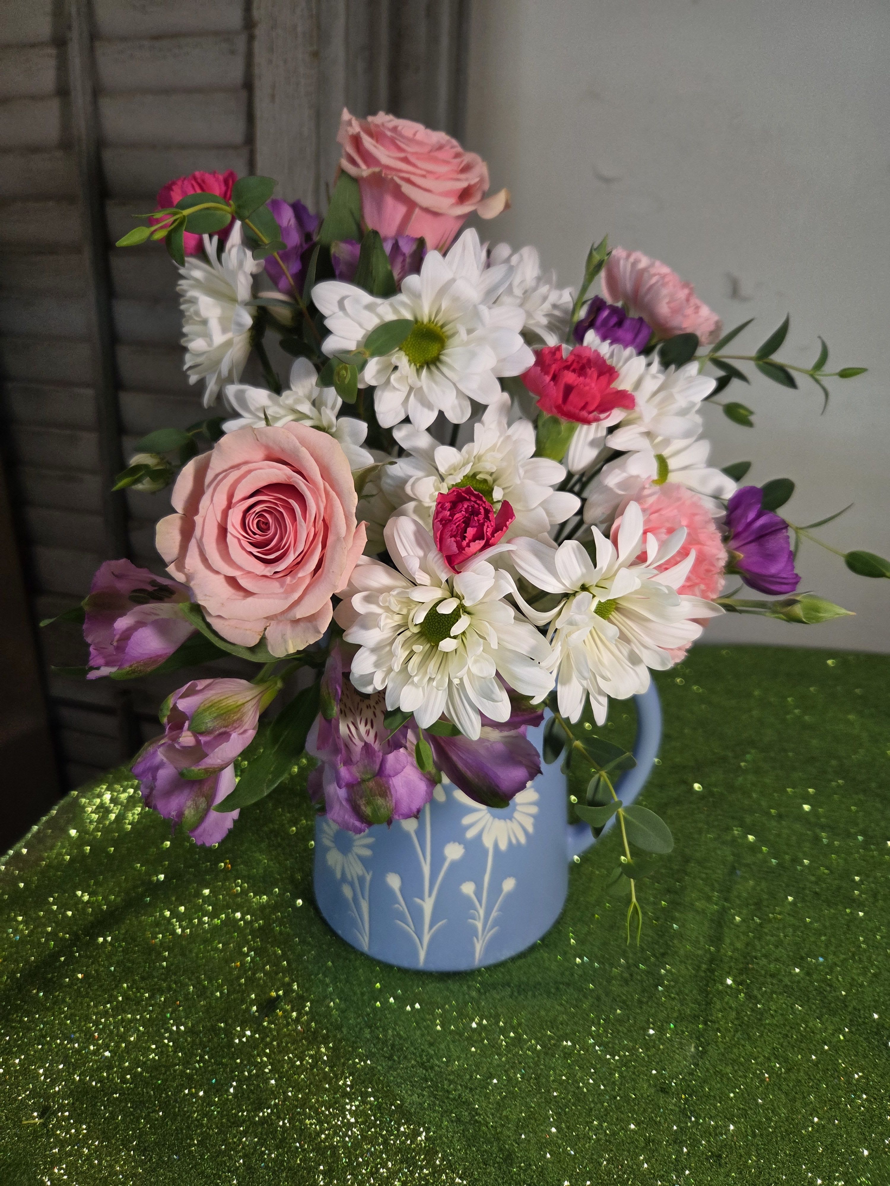pitcher2 - A beautiful blue pitcher full of pink, lavender, and white flowers to make this day special.