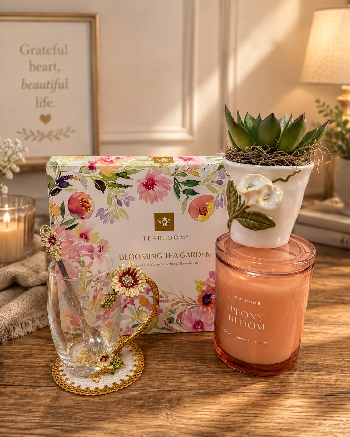 Bloom &amp; Serenity Gift Collection - A charming luxury gift set featuring a blooming tea garden collection, elegant floral glass tea cup with matching spoon, peony-scented candle, and modern succulent planter. Designed to bring beauty, relaxation, and a peaceful touch to any space, this curated collection makes the perfect gift for Mother’s Day, birthdays, thank you gifts, sympathy, or everyday appreciation.