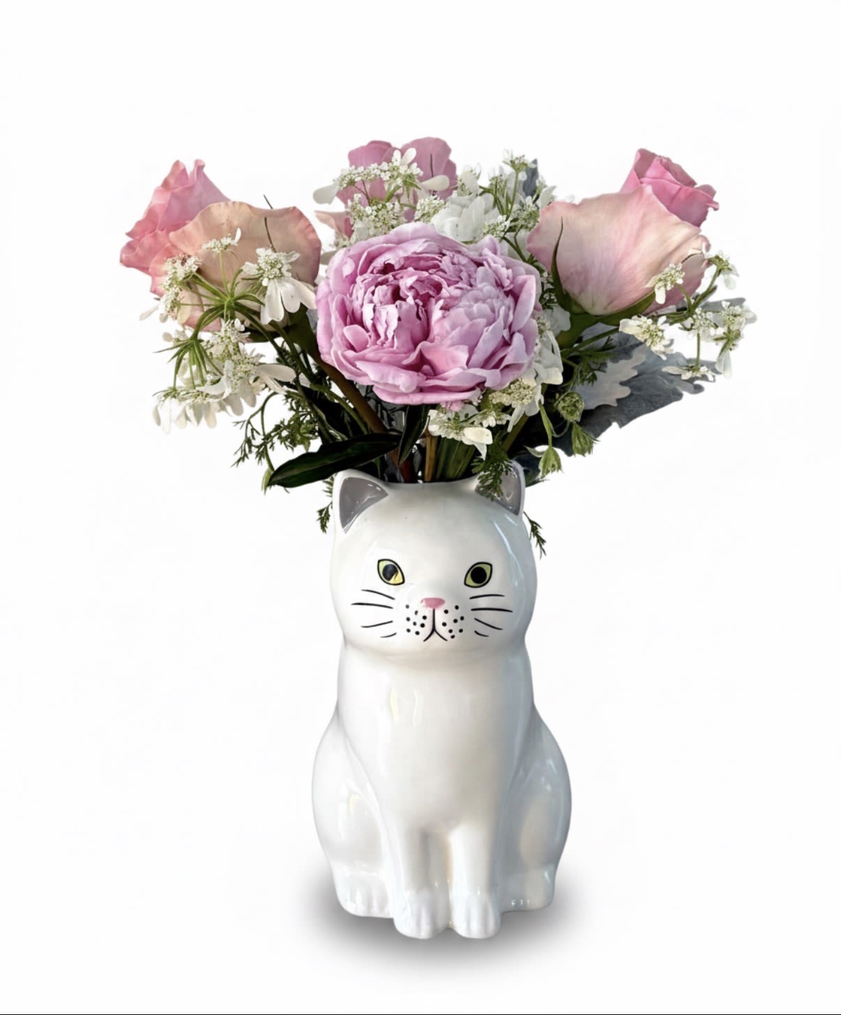 Meow and Forever Sweet Kitten Arrangement - Bring a touch of "purr-fection" to your home with this delightful arrangement that combines soft, romantic blooms with playful design. Nestled within a charming, hand-painted ceramic Daisy Cat vase, this bouquet features a stunning lush pink peony as its centerpiece, surrounded by delicate light pink roses and airy white filler flowers like Queen Anne's lace or baby's breath.   Vase: Part of the Quail Ceramics collection, this high-quality stoneware piece is intricately hand-painted with lifelike detail, capturing the curious and gentle spirit of a feline friend. Flowers: A luxurious mix of fresh-cut peonies and roses, creating a palette as soft as a kitten's paws.