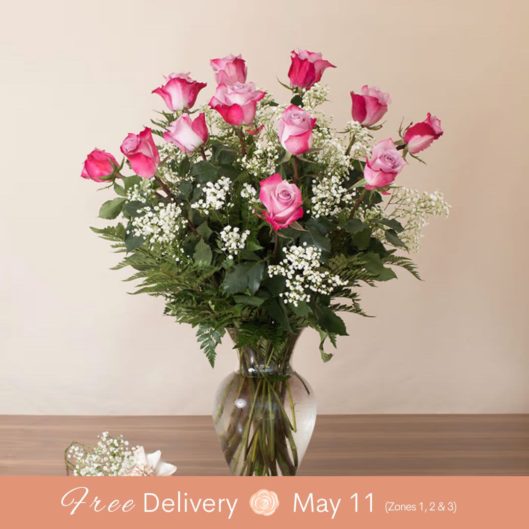 Lush Lavender for Mom Masterpiece  - Enchant your special someone with this exquisite Irresistible Lavender Rose Arrangement, a perfect blend of elegance and charm.  Showcasing 12 lush, premium long-stem lavender roses, with natural pink hues that add a unique and romantic touch. Complemented by fresh accent greens, arranged in a timeless glass vase for an effortlessly sophisticated display.  Note: In the event of a product shortage, rose color may be substituted with a Pretty Pastel arrangement. To ensure your preferences are met, please specify two alternate colors in the "Specific Instructions" box during checkout. Color options: Pink, White, Lavender, Yellow  This stunning arrangement is ideal for expressing love, admiration, or celebration, making it a memorable gift your loved one will treasure. 