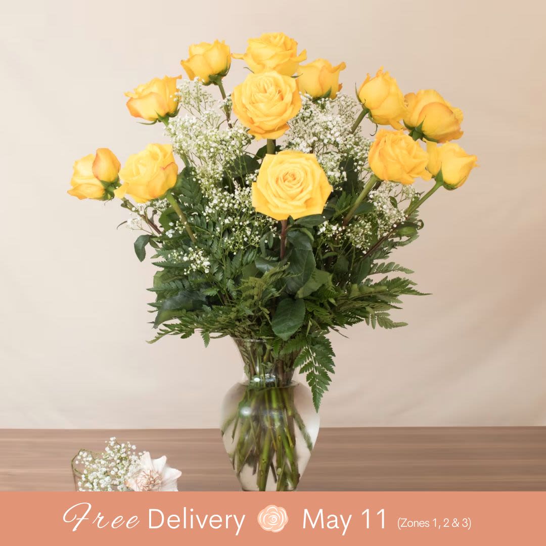 Mom's Yellow Masterpiece  - Bring sunshine to someone’s day with our Brighten Their Day Yellow Rose Arrangement, a cheerful and heartfelt gift for any occasion.  Includes a dozen premium Long stem yellow roses, radiating warmth and positivity. Perfectly arranged to brighten the mood of your special someone and spread joy.  Note: In the event of a product shortage, the rose color may be substituted with a Pretty Pastel arrangement. To ensure your preferences are met, please specify two alternate colors in the "Specific Instructions" box during checkout.  Color options: Pink, White, Lavender, Yellow  This vibrant arrangement is the ideal way to express appreciation, friendship, or love with a touch of brightness and beauty. 