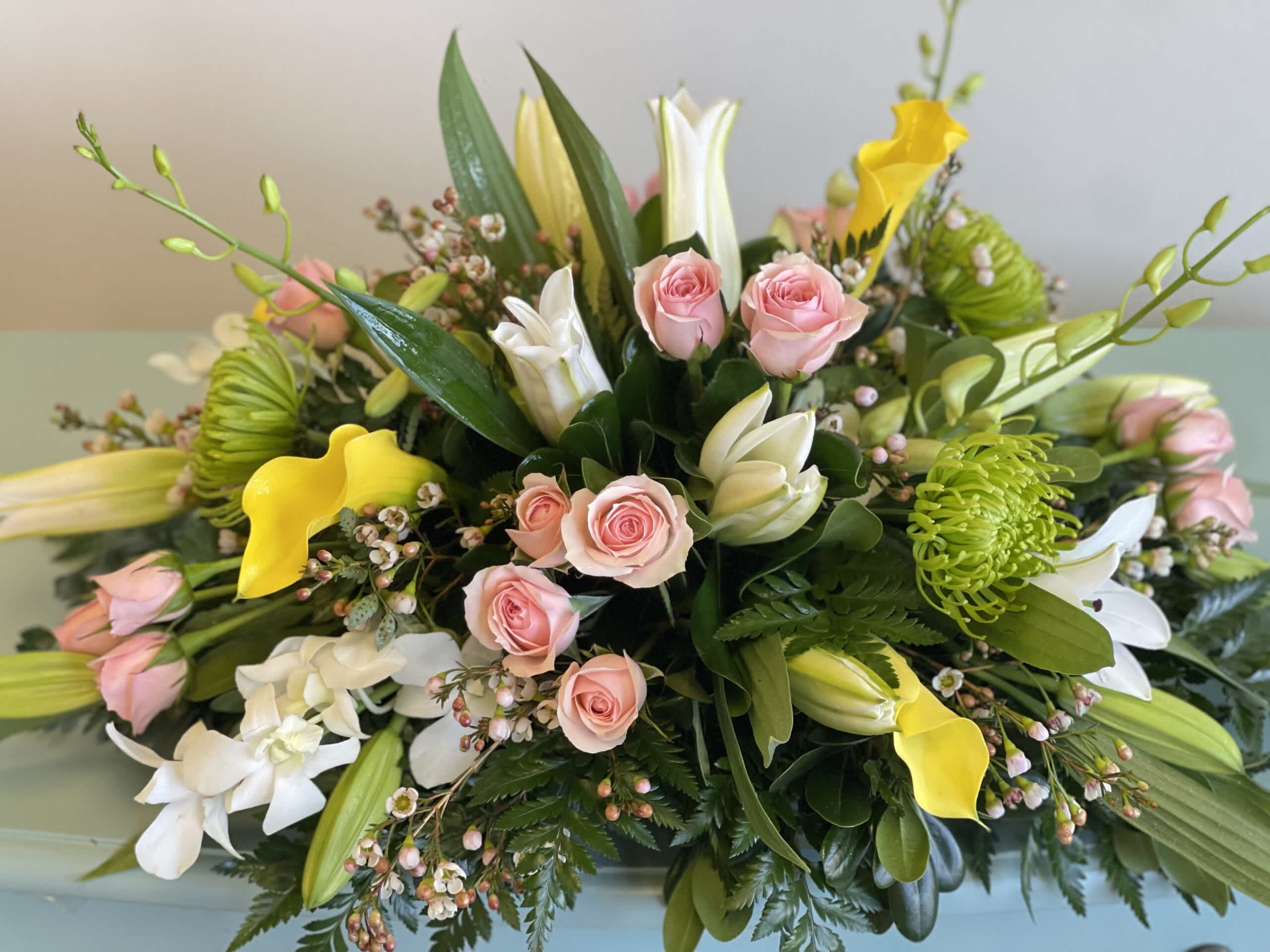 Mixed bouquet with pink roses, white lilies, and yellow calla lilies