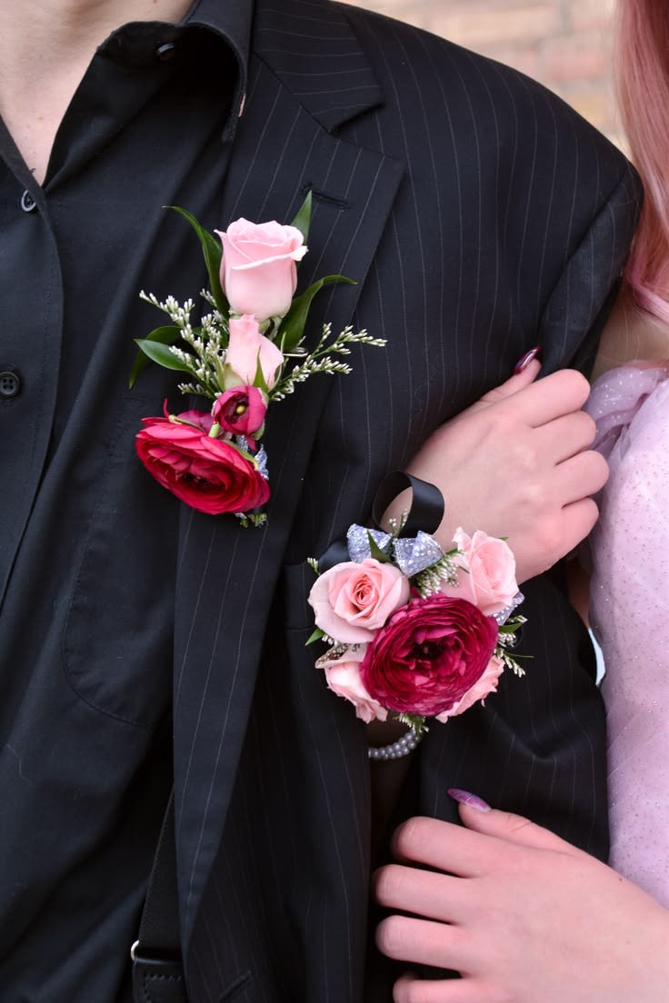 Berry Romance Corsage &amp; Boutonniere Set - This matching corsage and boutonniere set features fresh pink roses, deep berry ranunculus blooms, delicate filler flowers, and elegant ribbon accents for a bold and romantic prom look.  Designed with fresh flowers and rich color contrast, this set creates a modern and eye-catching statement for your special night.  Includes: • Wrist corsage • Matching boutonniere • Fresh flowers • Ribbon detailing  If you would like a different ribbon color to match your outfit or prom theme, please leave your preferred color in the notes section at checkout.    This design can be customized to match your dress or prom colors. Please leave your dress color or inspiration details in the notes section at checkout, and we will create a beautifully coordinated set just for you.  