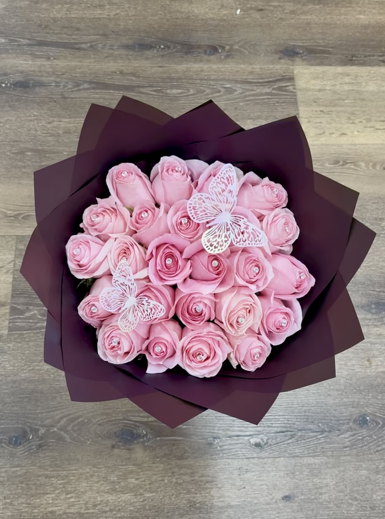Pink Nature Bouquet - Perfect for pink lovers! You get a various amount of pink roses with some pink butterflies fluttering around keeping the company. Each rose comes with a pinned diamond. 