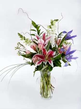$100 Designer's Choice - Wanting something unique? Allow our designers to create a beautiful arrangement for you! This larger sized arrangement will include our best product. Feel free to include a preference if you have one, and we will do our best to accommodate you. Please keep in mind that we won't always have every flower in stock!